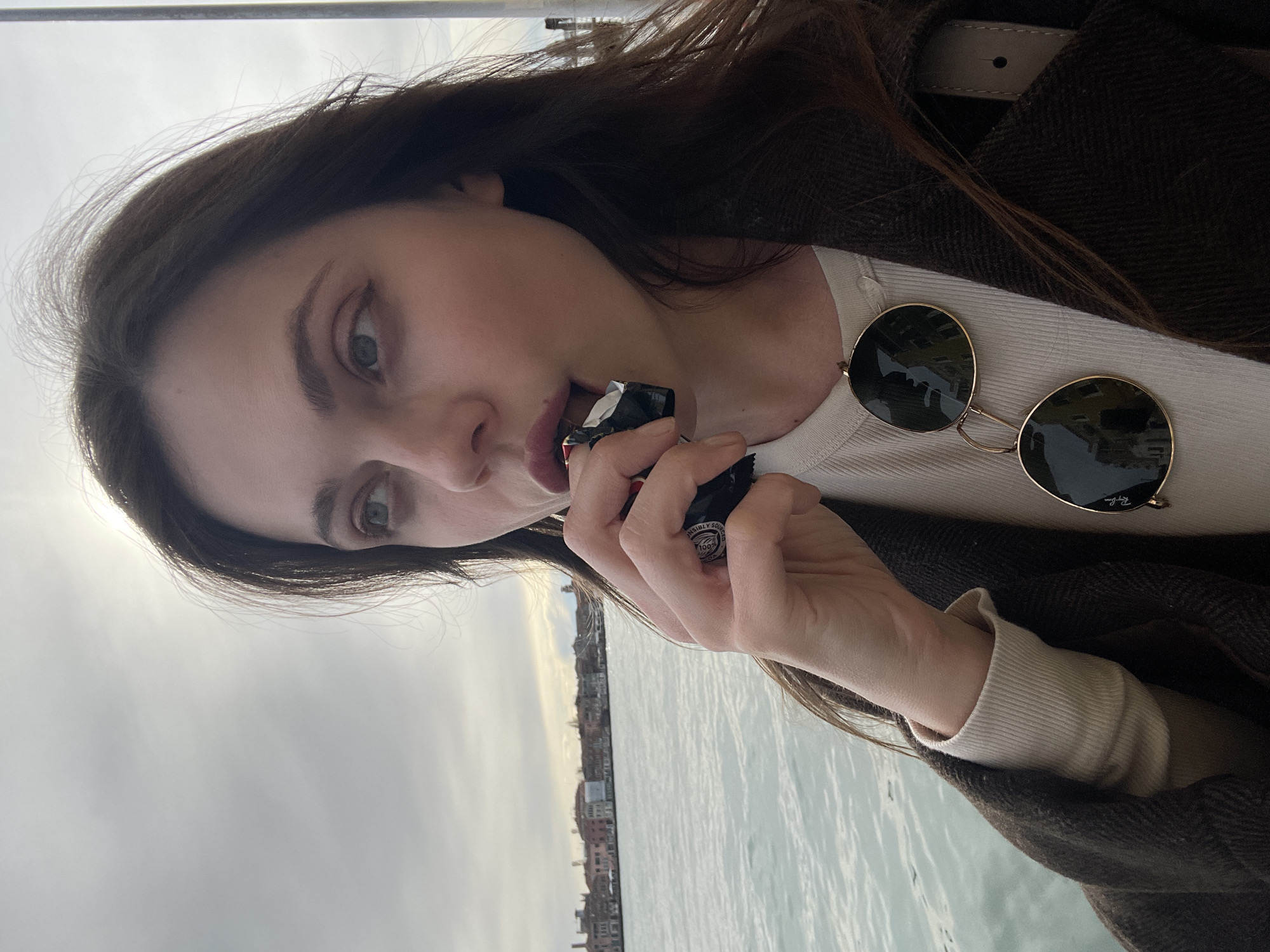 Tourist takes selfie along Venice canals amid historic architecture