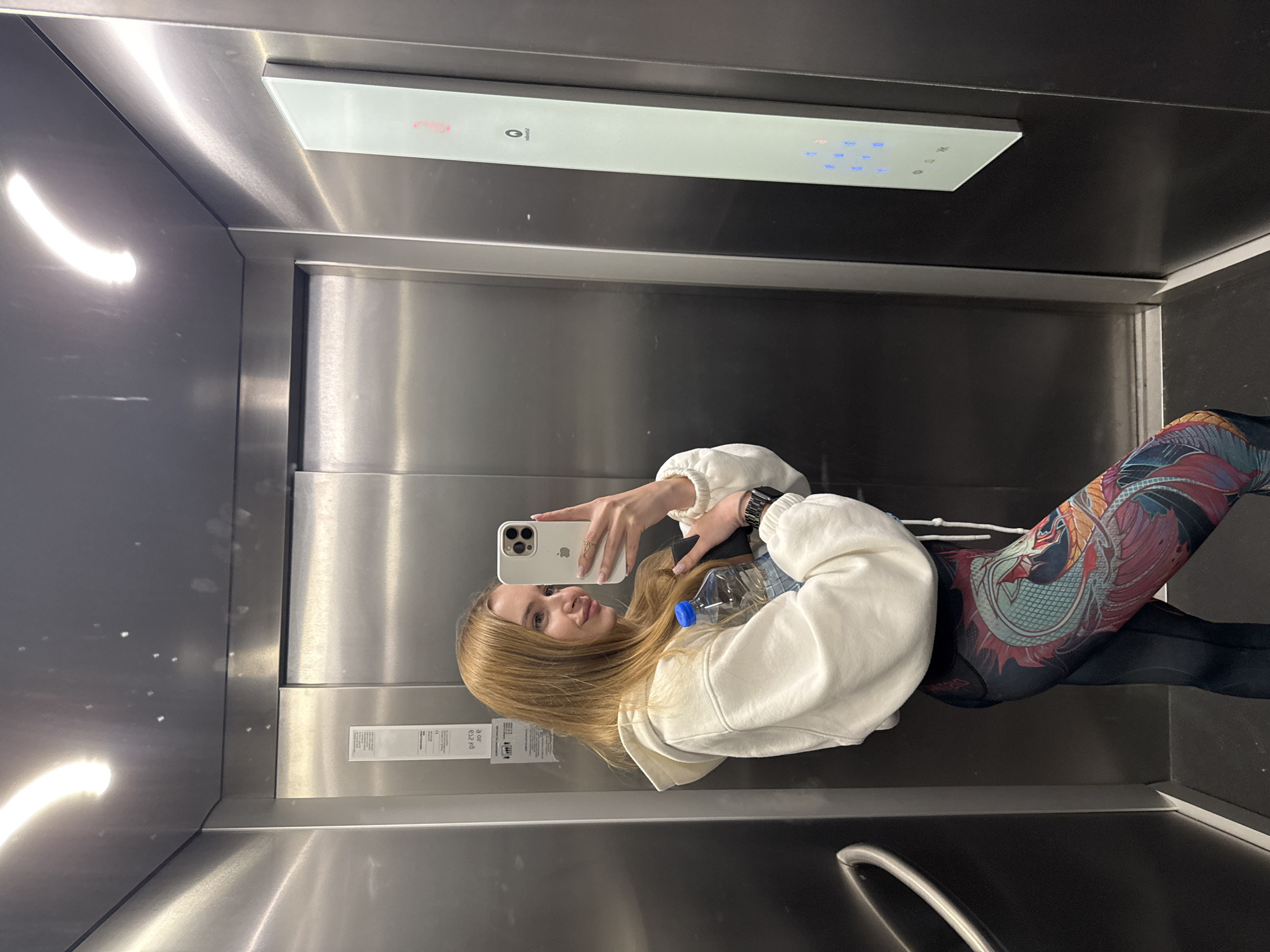 Woman takes elevator selfie in Budva, Montenegro