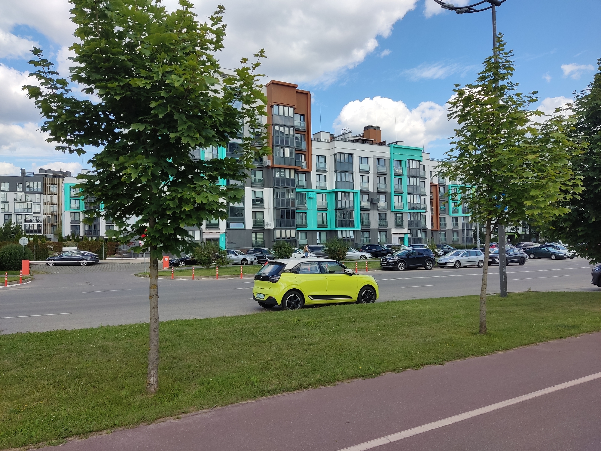 Colorful apartment blocks and street-level details in Baravliany, Belarus