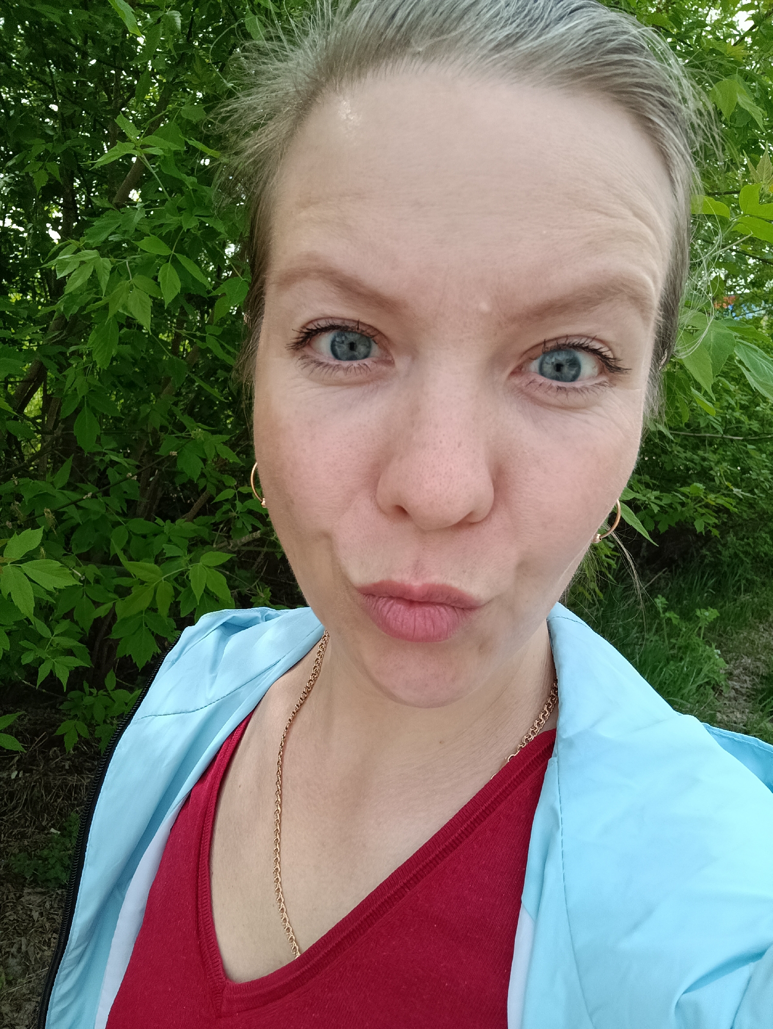 Woman documents spring morning with selfies and flower photography