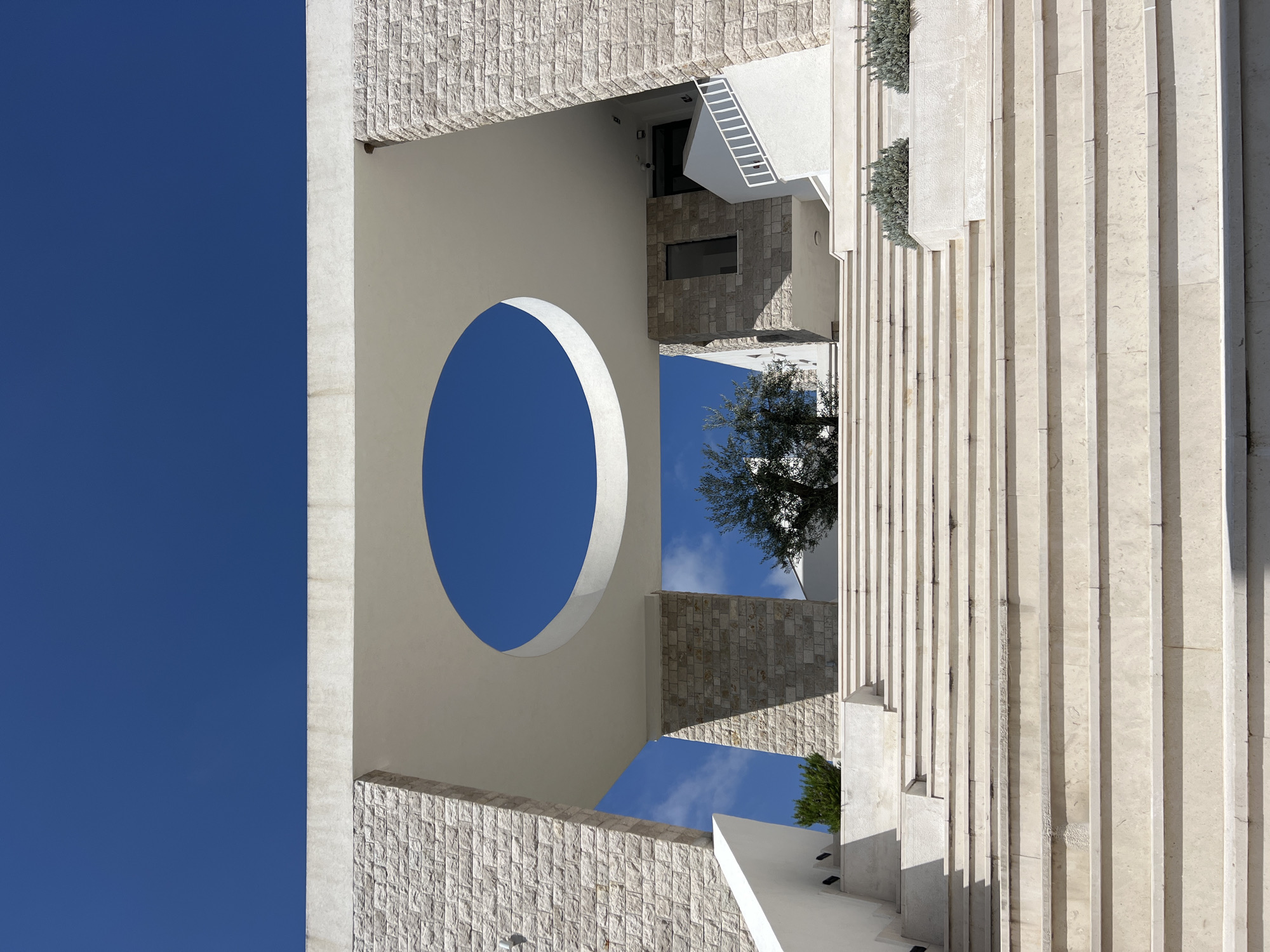Building with circular opening photographed in Stari Bar, Montenegro