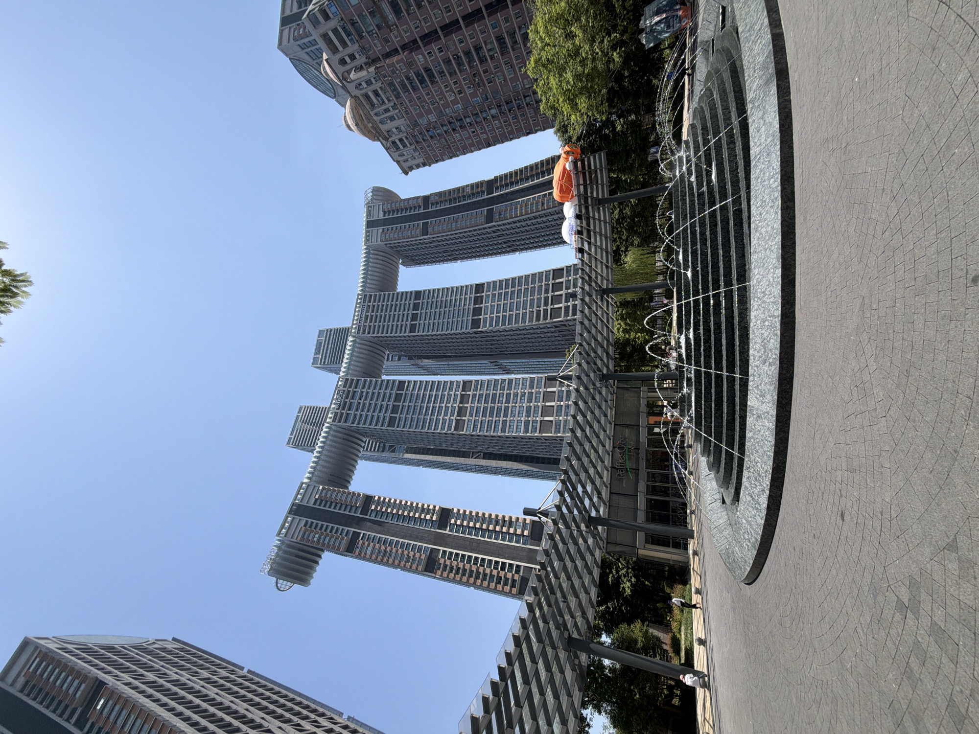 Raffles City Chongqing plaza and riverfront on a sunny morning