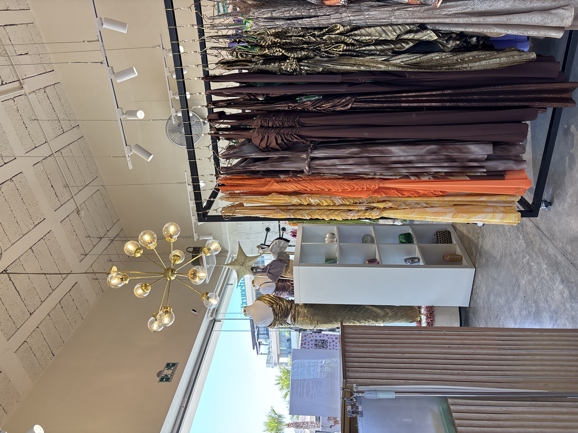 Clothing boutique interior documented in San Bernardino Tlaxcalancingo, Mexico