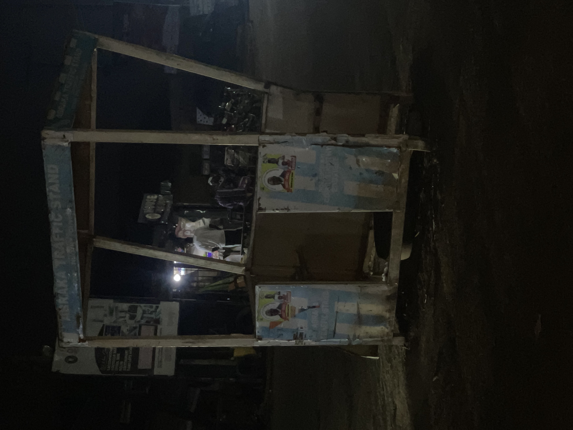 Nighttime street vendors serve customers in Abraka, Nigeria