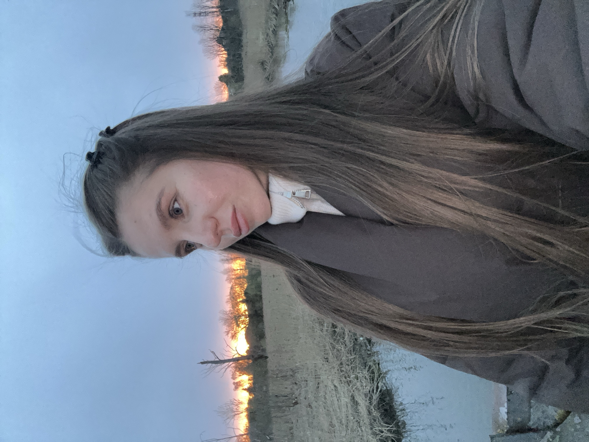 Woman photographed on bridge during sunset in Klin, Russia