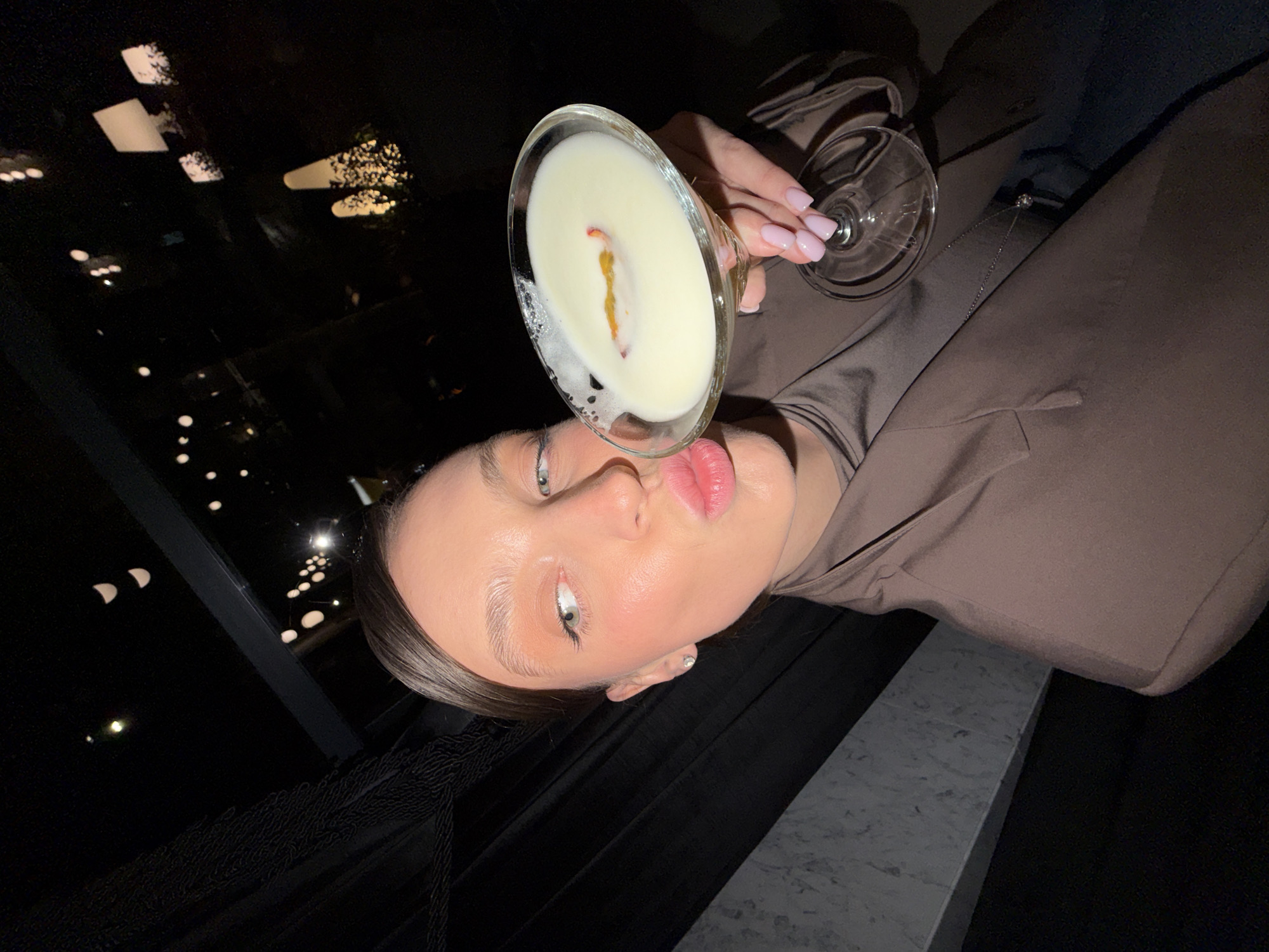 Woman enjoys cocktails at Budva establishment Saturday evening