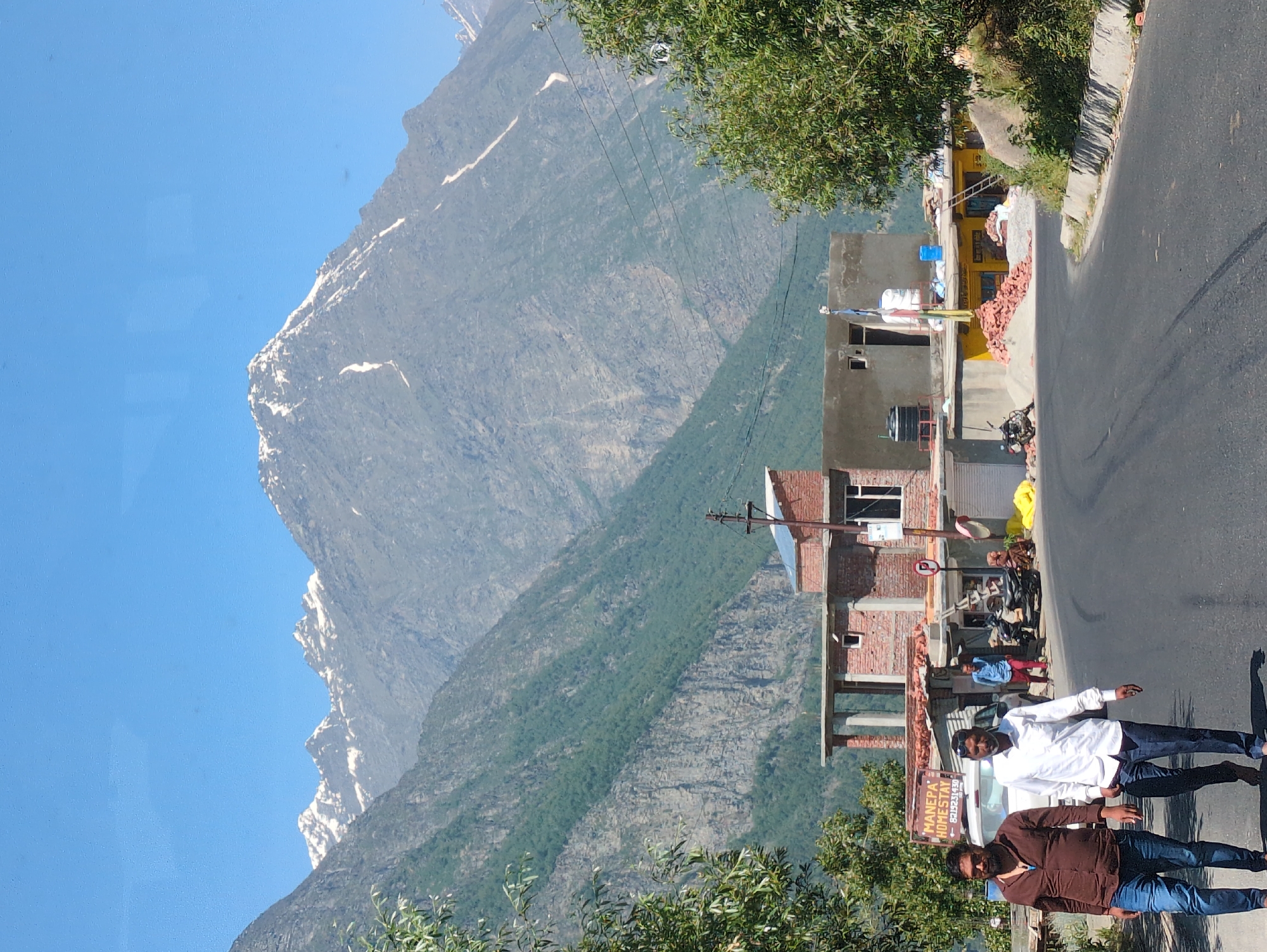 On foot and by vehicle along a winding mountain road in Gondhla