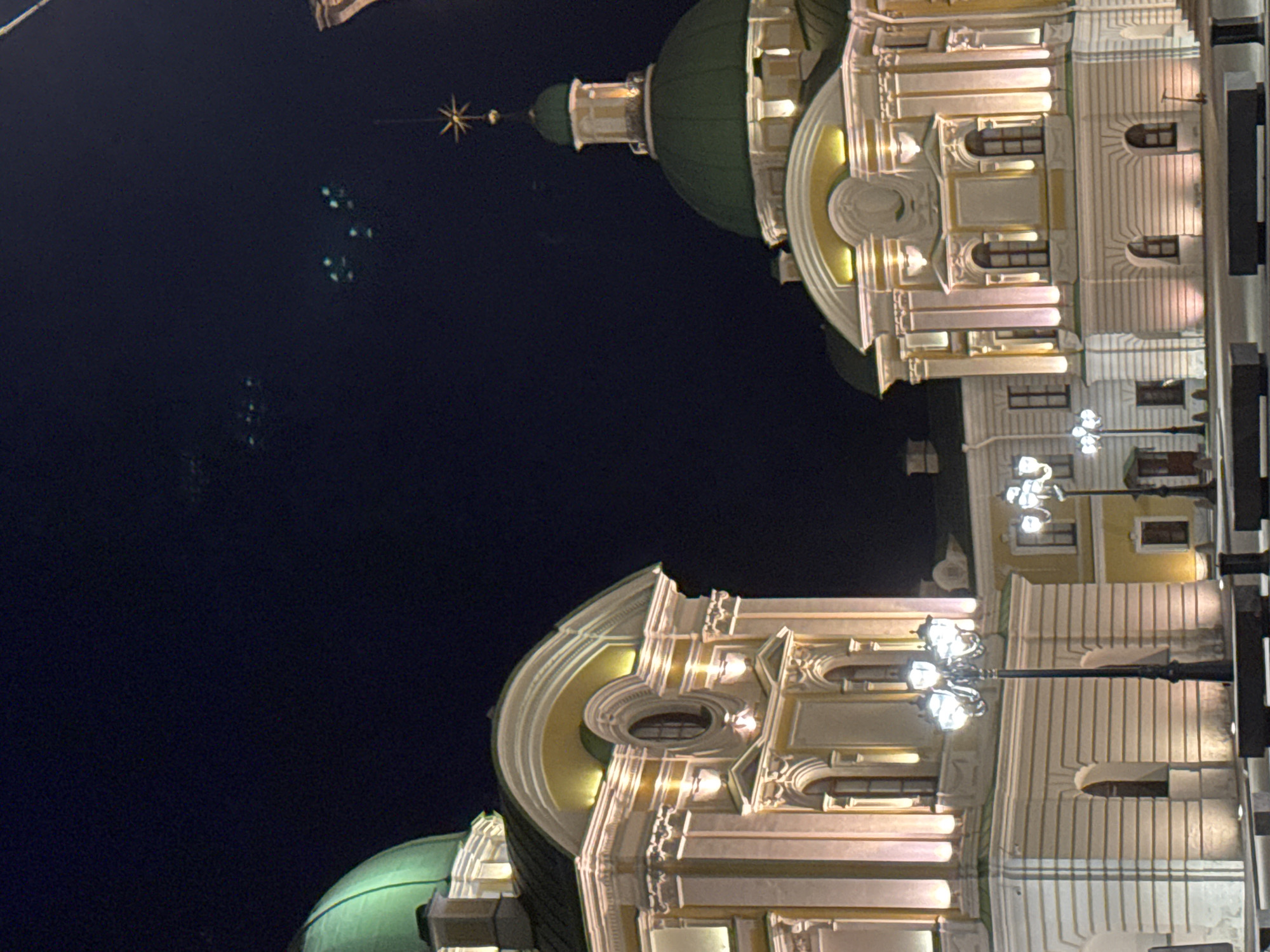Illuminated domed building photographed at night in Tver, Russia
