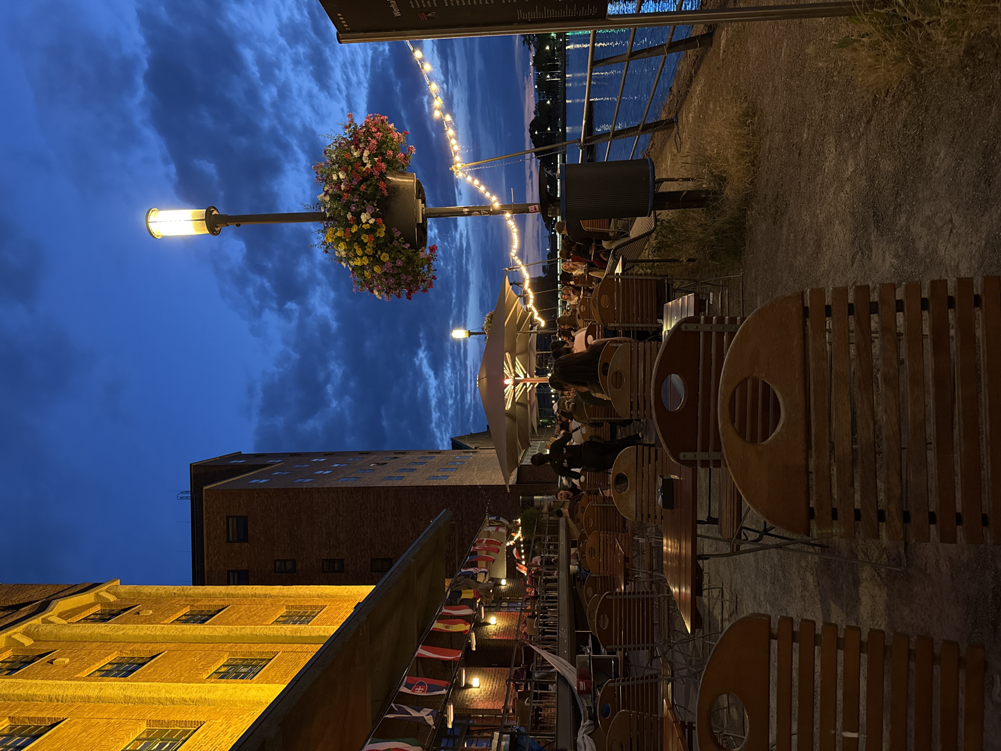 Duisburg's inner harbor at twilight, restaurant and canal reflections