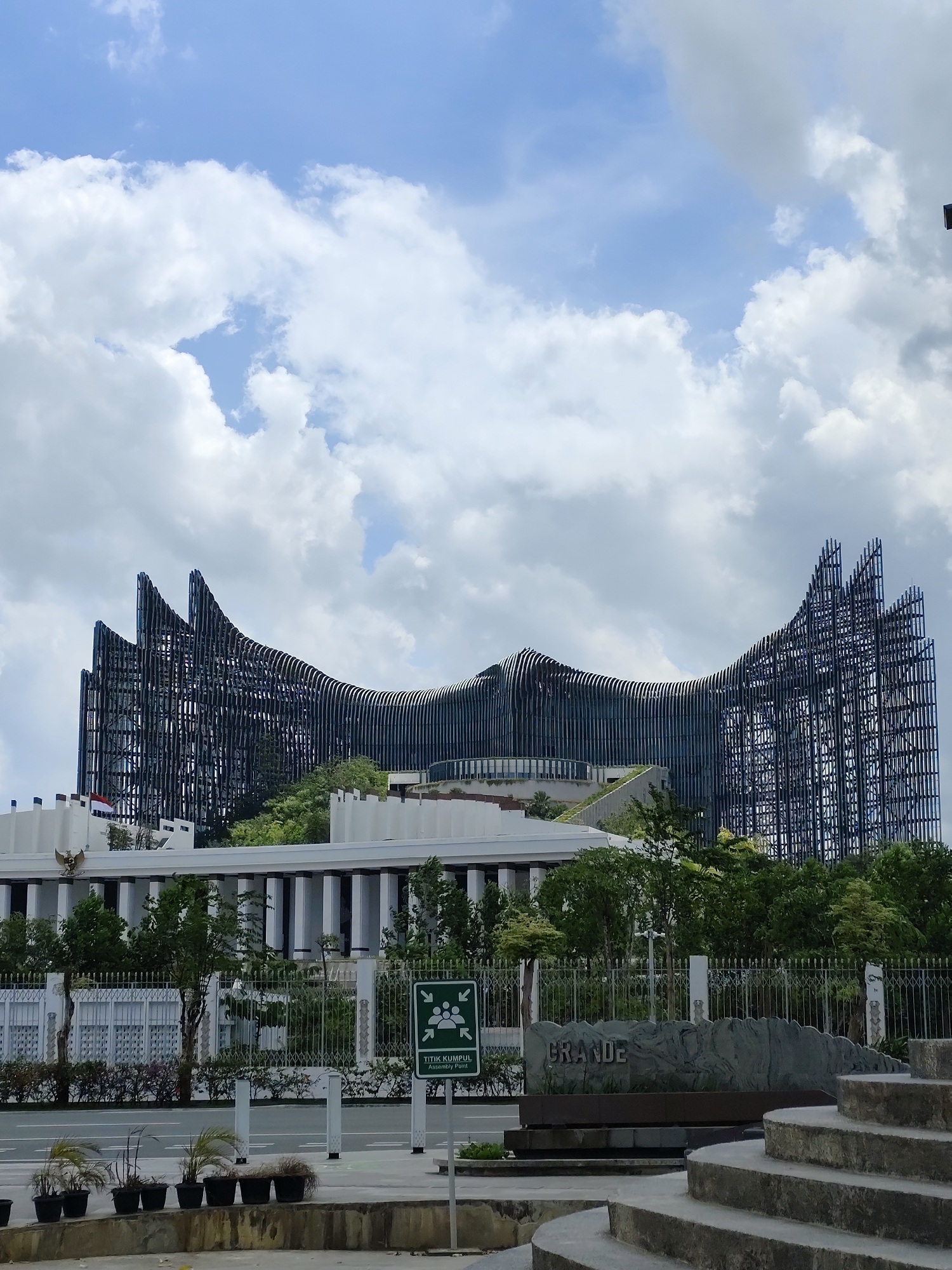 Afternoon foot traffic around a striking wave-facade public building