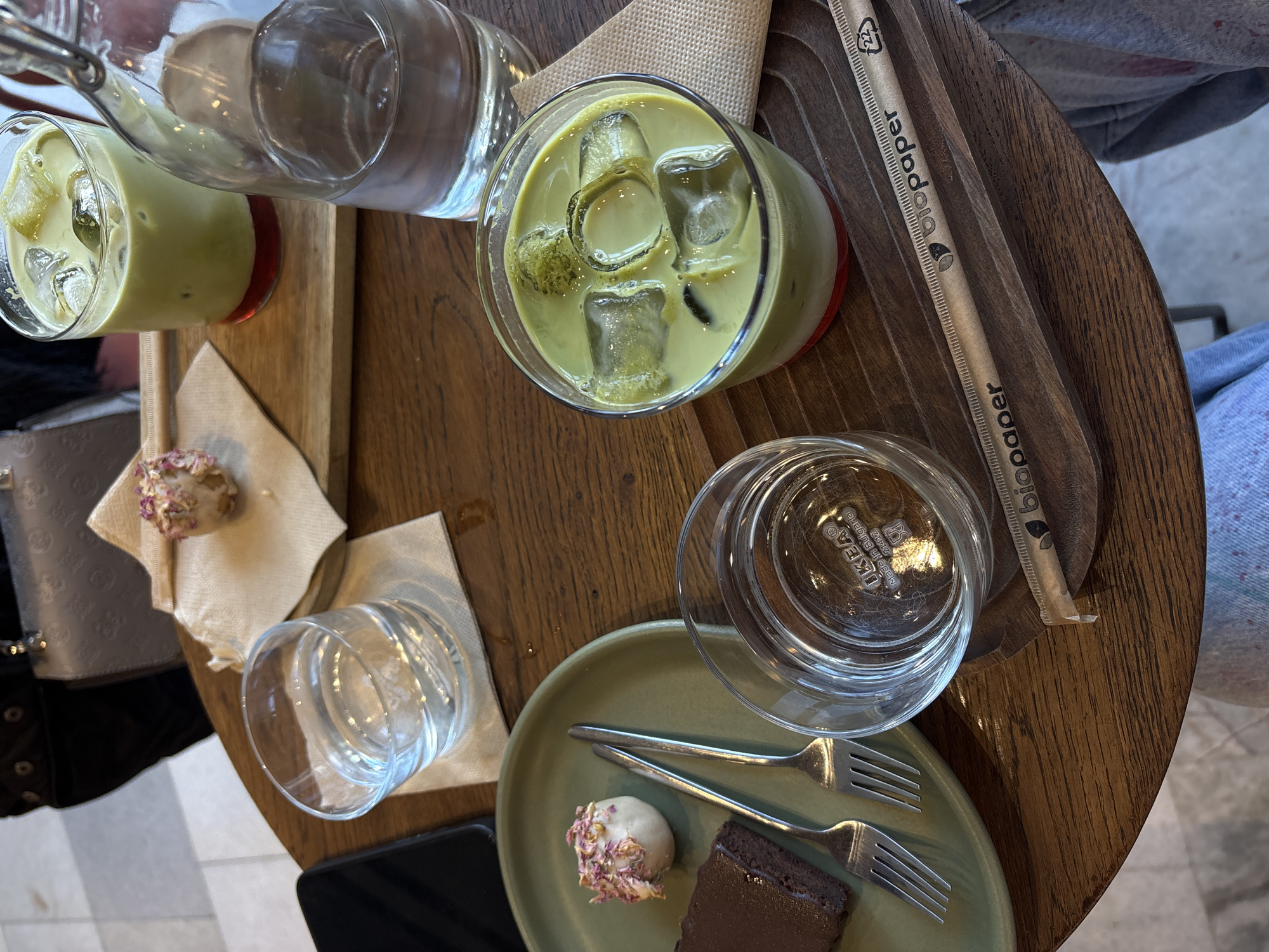 Café patron enjoys iced matcha latte in Varna, Bulgaria