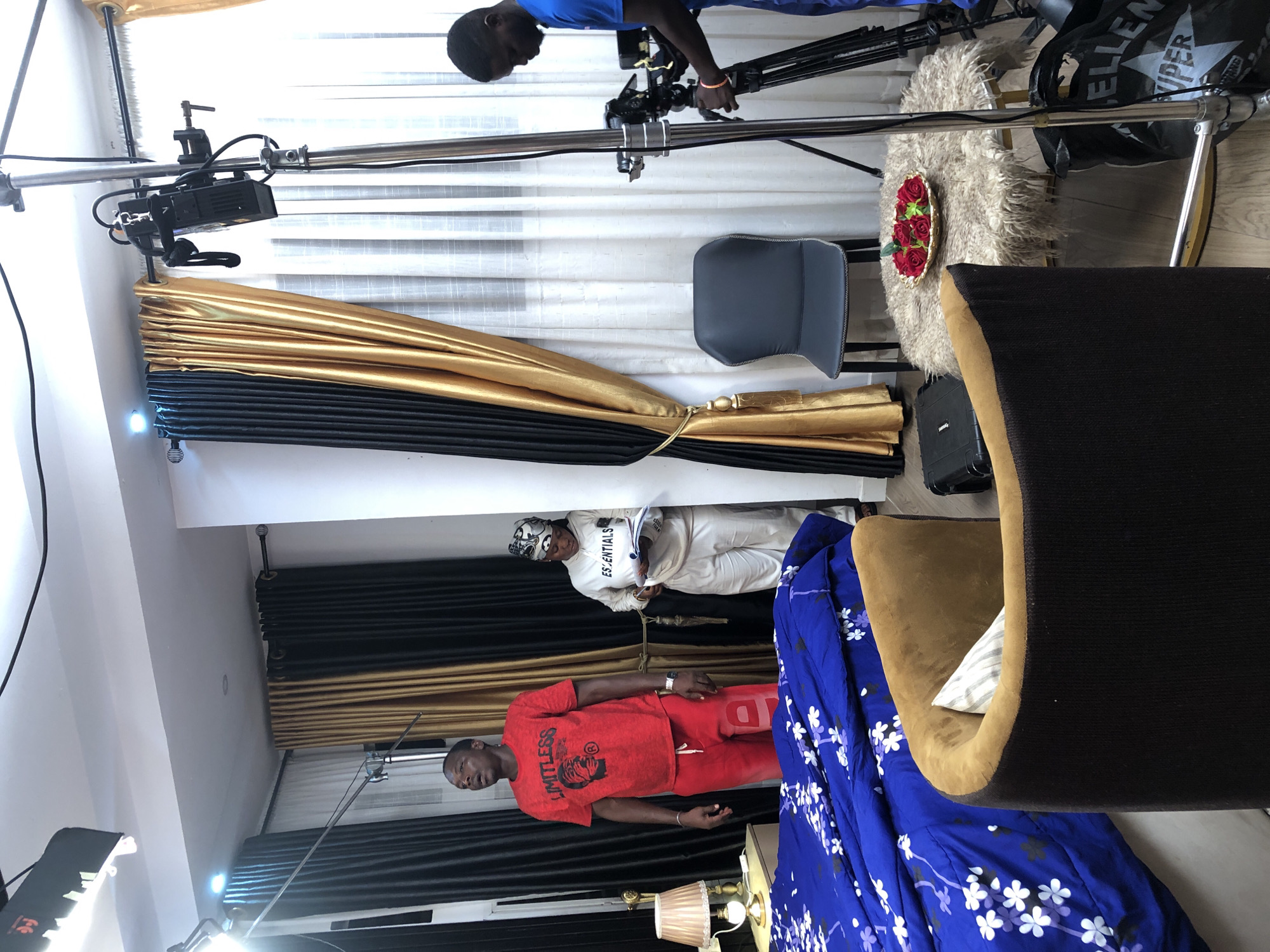 Professional film shoot documented in residential studio space