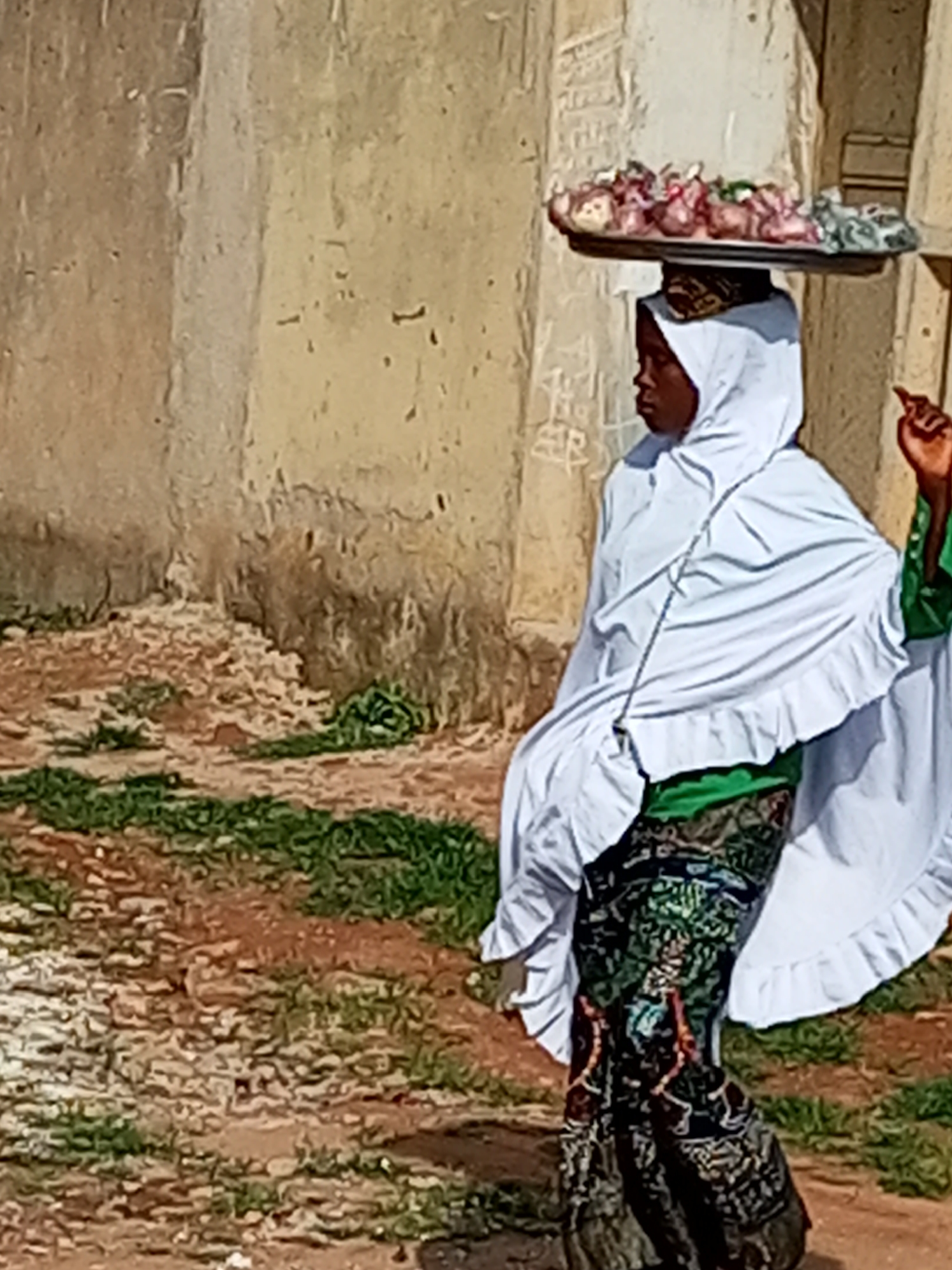 Outdoor candid moments: tray-carrying and a direct-camera look