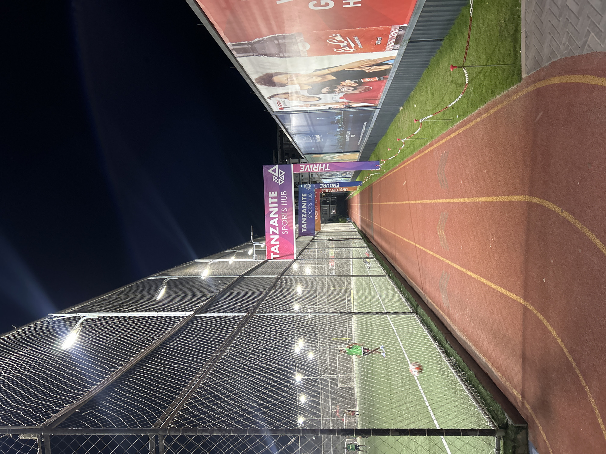 Night at a Dar es Salaam sports complex, June 2026