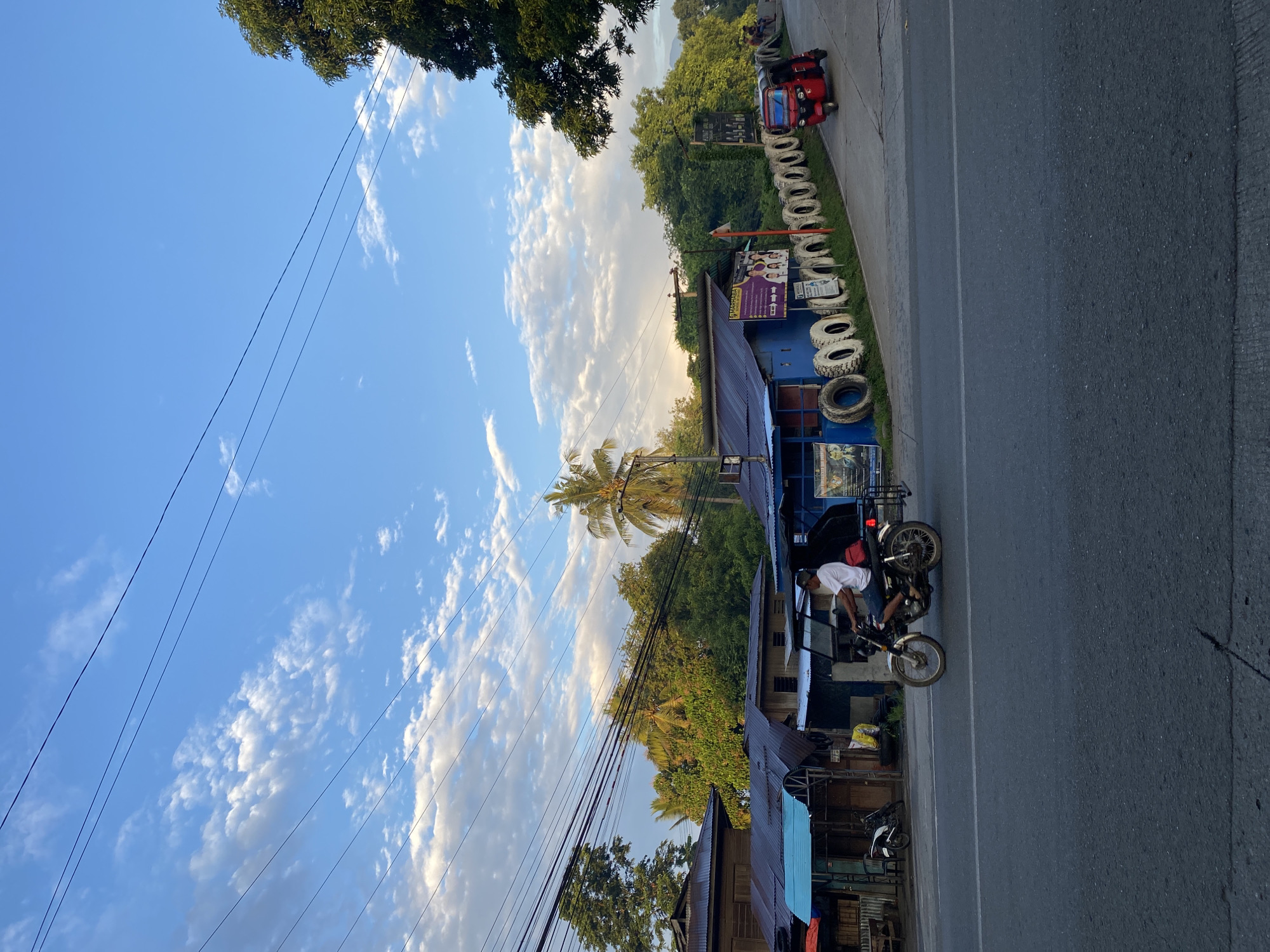 Davao City road corridor at golden hour, Crossing Bayabas