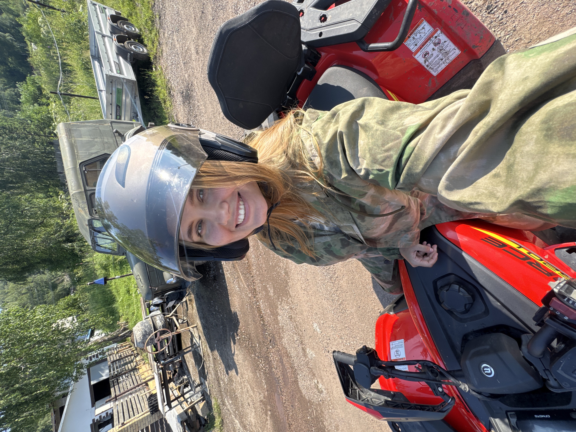 Red ATVs, helmets, and a happy Samoyed in Krasnoyarsk