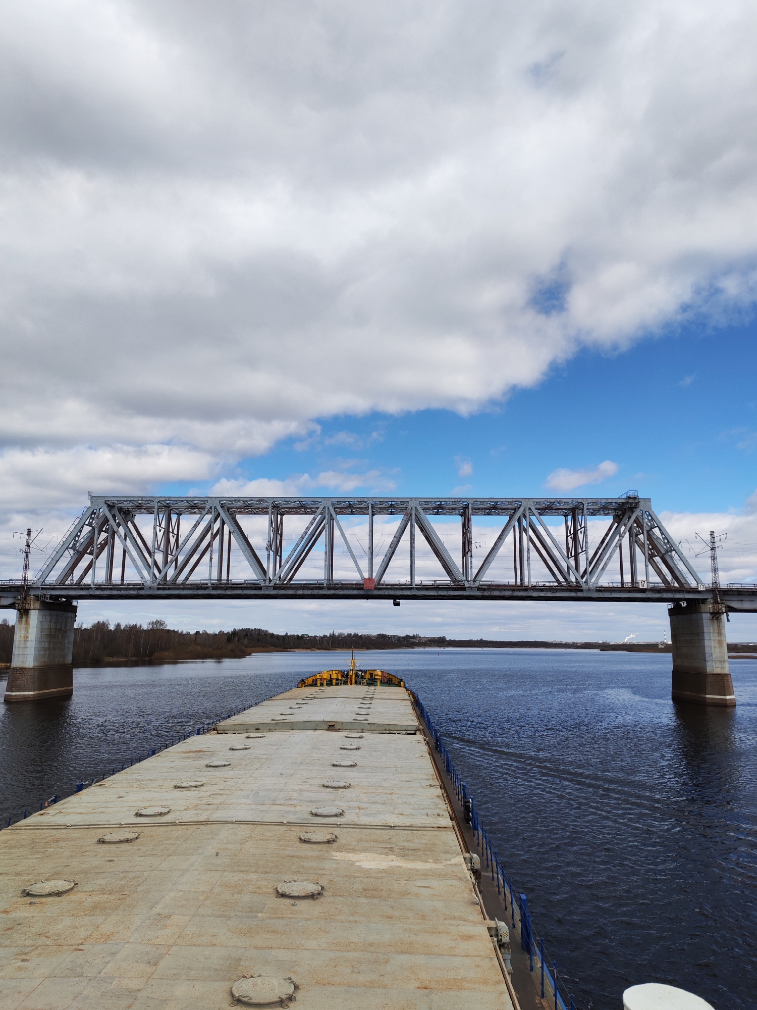 River traffic navigates beneath bridges during morning transit
