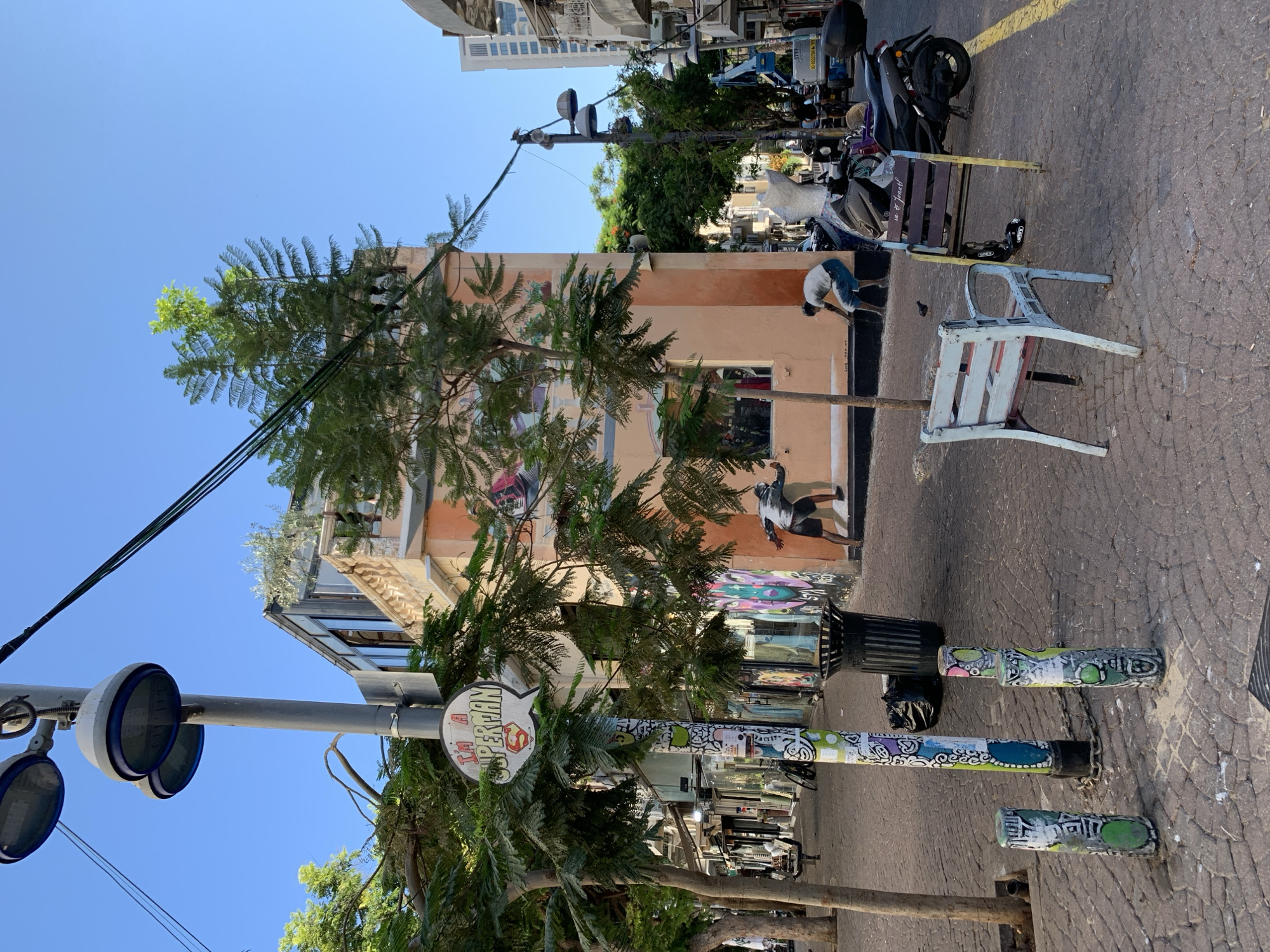 Sunny afternoon on a graffiti-lined Tel Aviv street