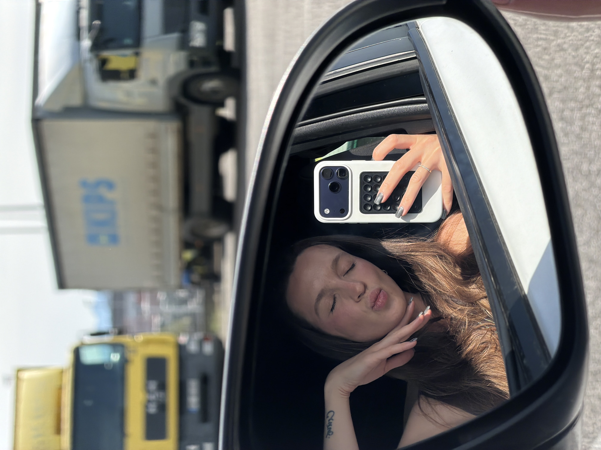Woman takes selfies with dog in car, Montenegro