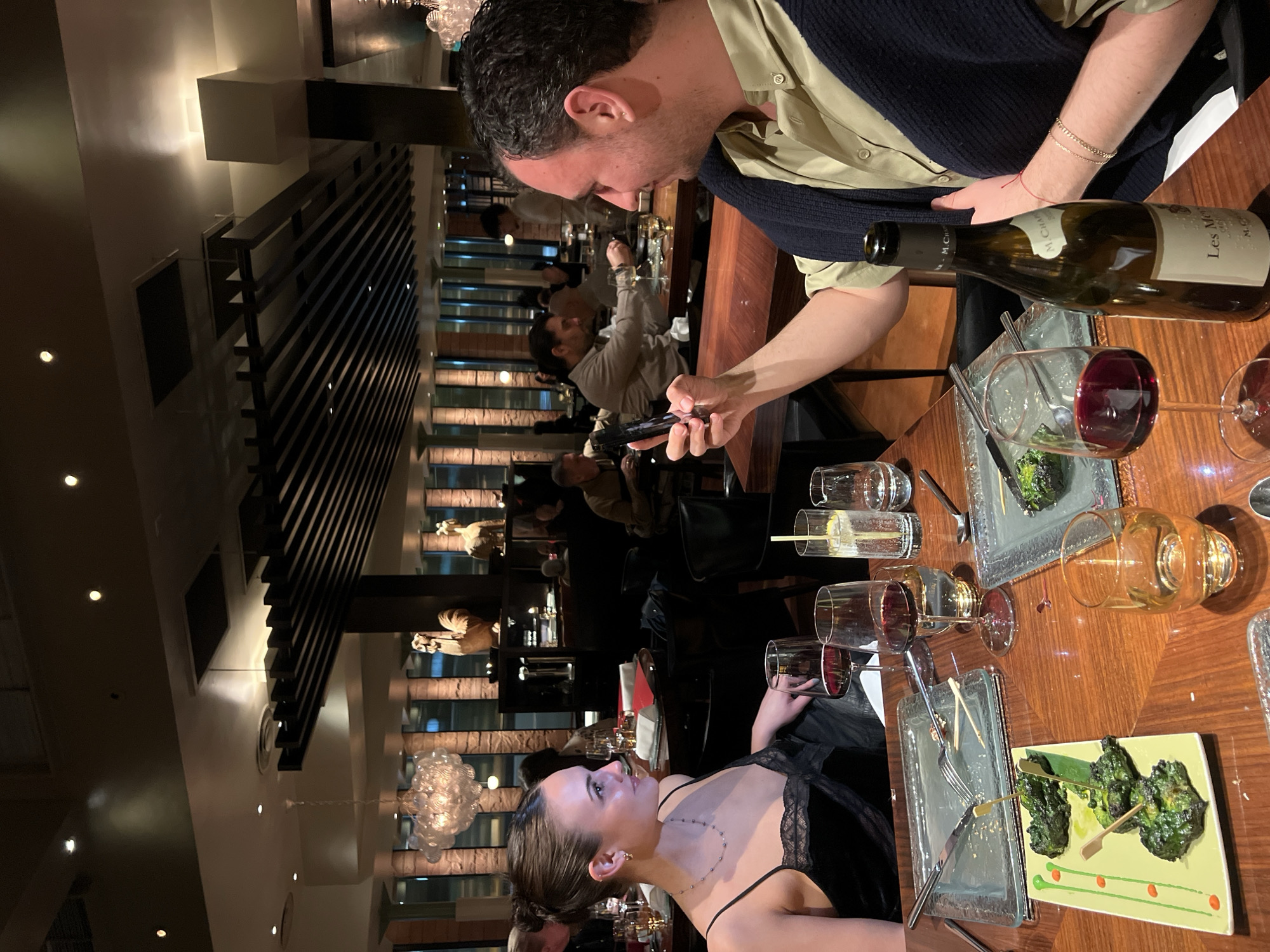 Couple photographs dinner at upscale London restaurant