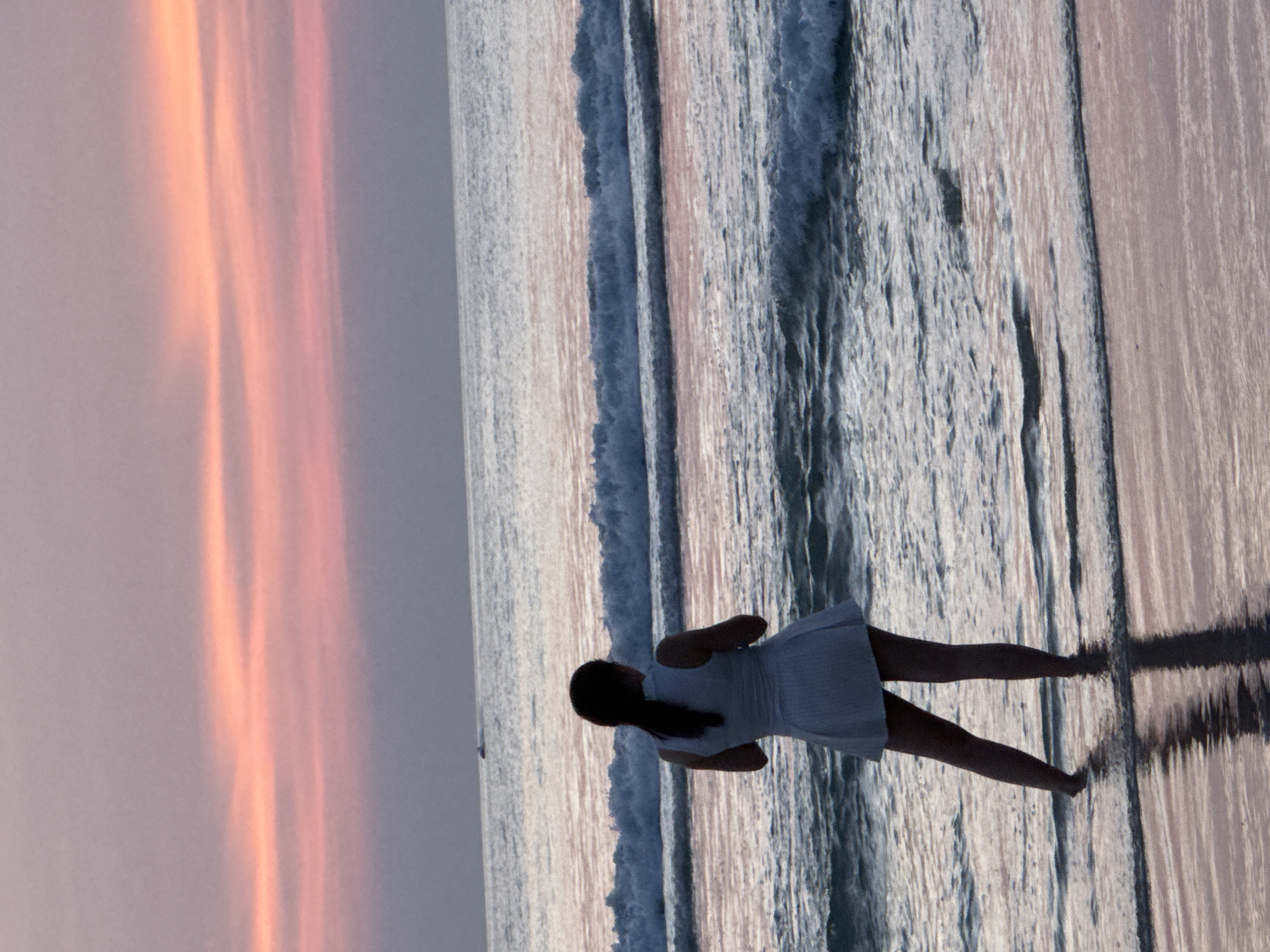 Sunset hour on Patong Beach: parasailing, fishing, and shoreline calm