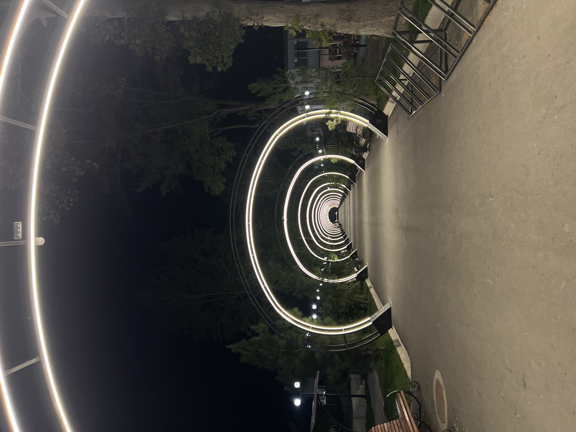 Illuminated arch pathway lights up Kadamjay at night