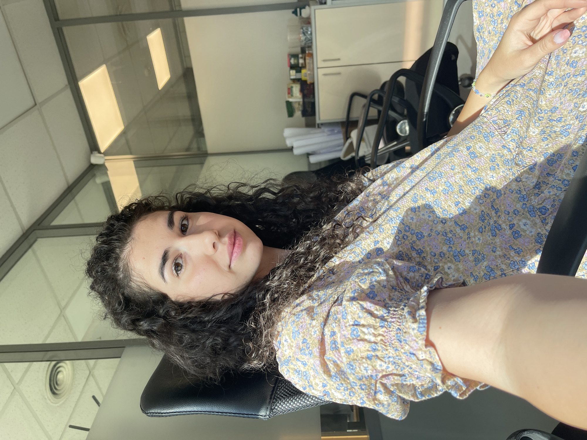 Woman's morning routine documented in Sofia office setting