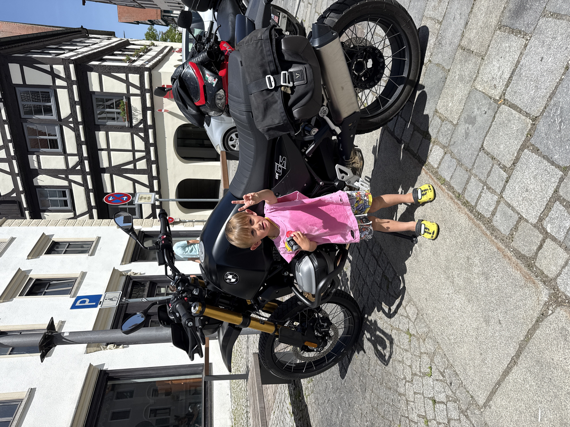 Child plays on motorcycles, enjoys ice cream in Riedlingen