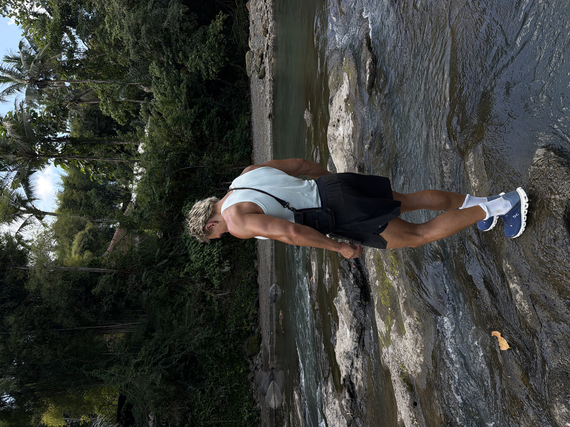Man explores rocky river areas in Indonesia morning