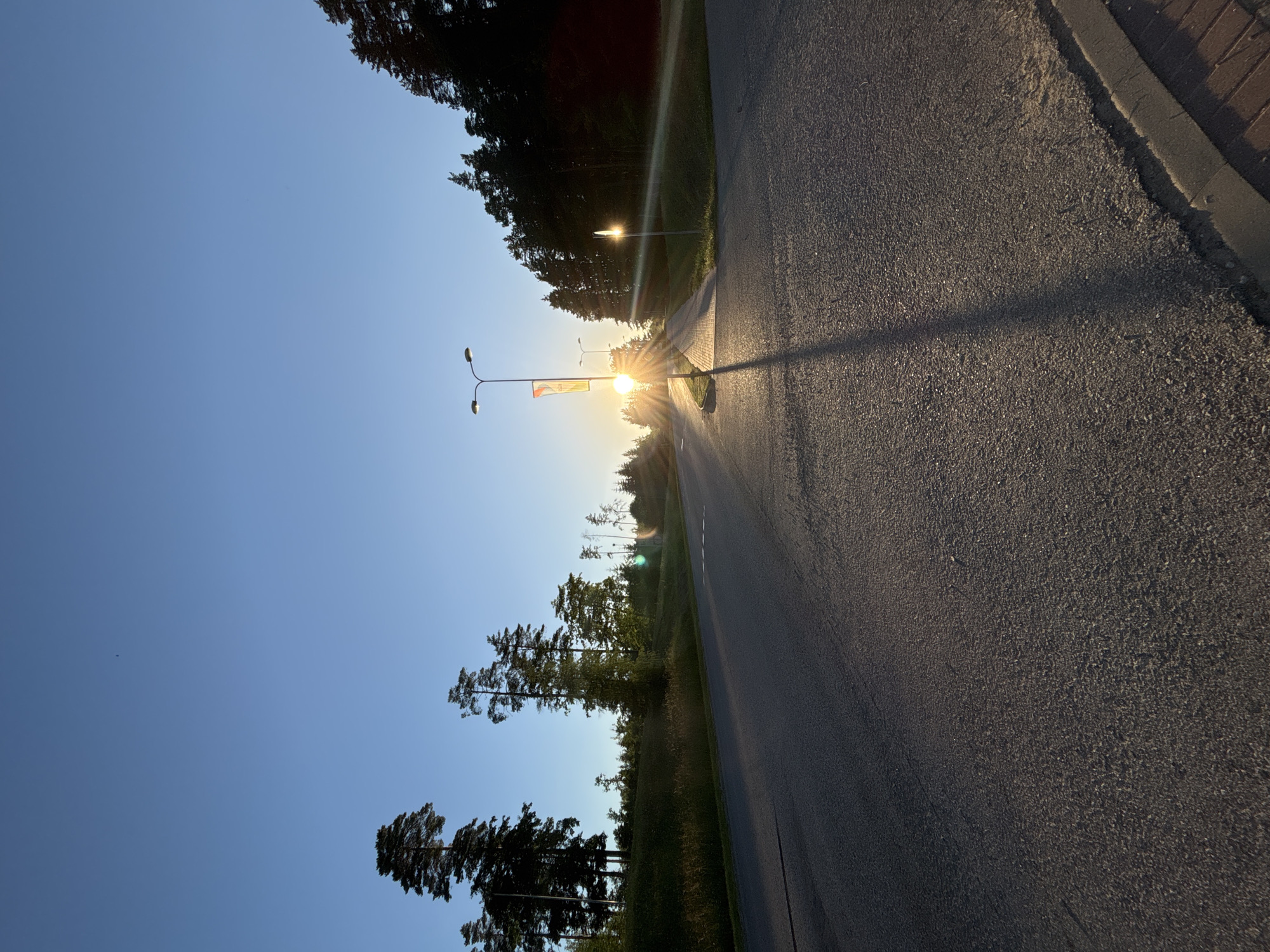 Evening stroll through Madona's tree-lined streets at golden hour