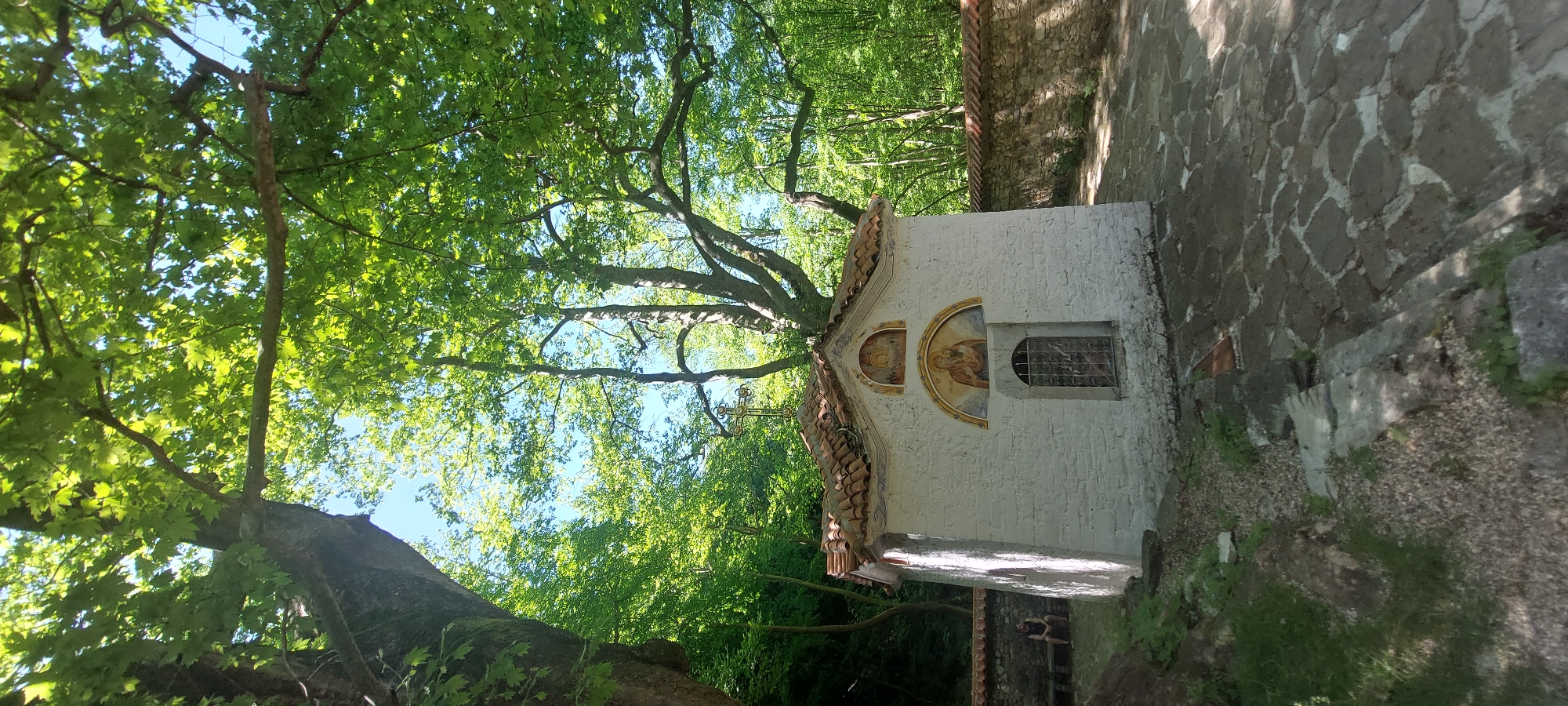 Visitor documents Bachkovo Monastery's religious art and natural surroundings
