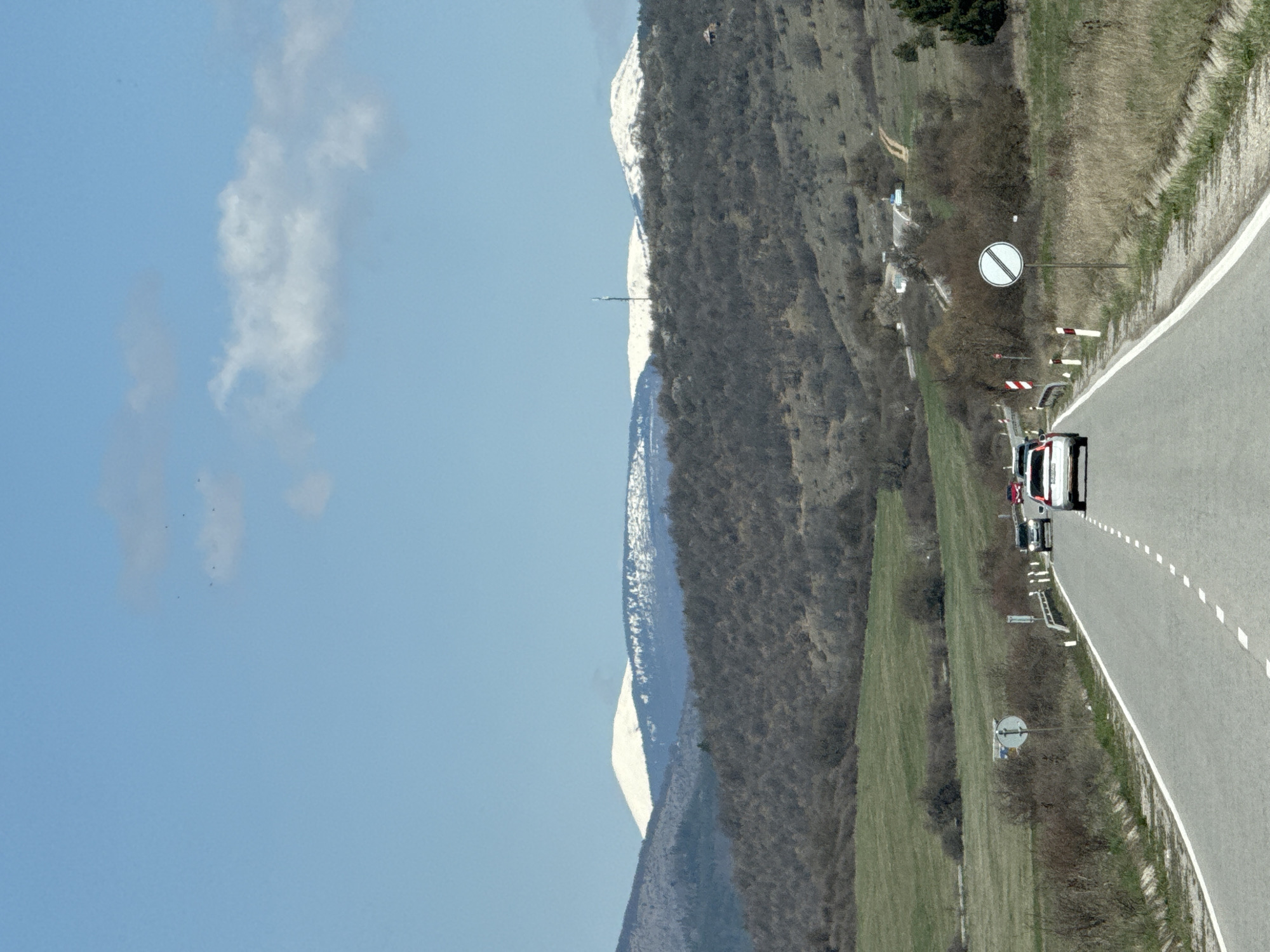 Road scene documented in Drenovo, Bulgaria with mountain backdrop