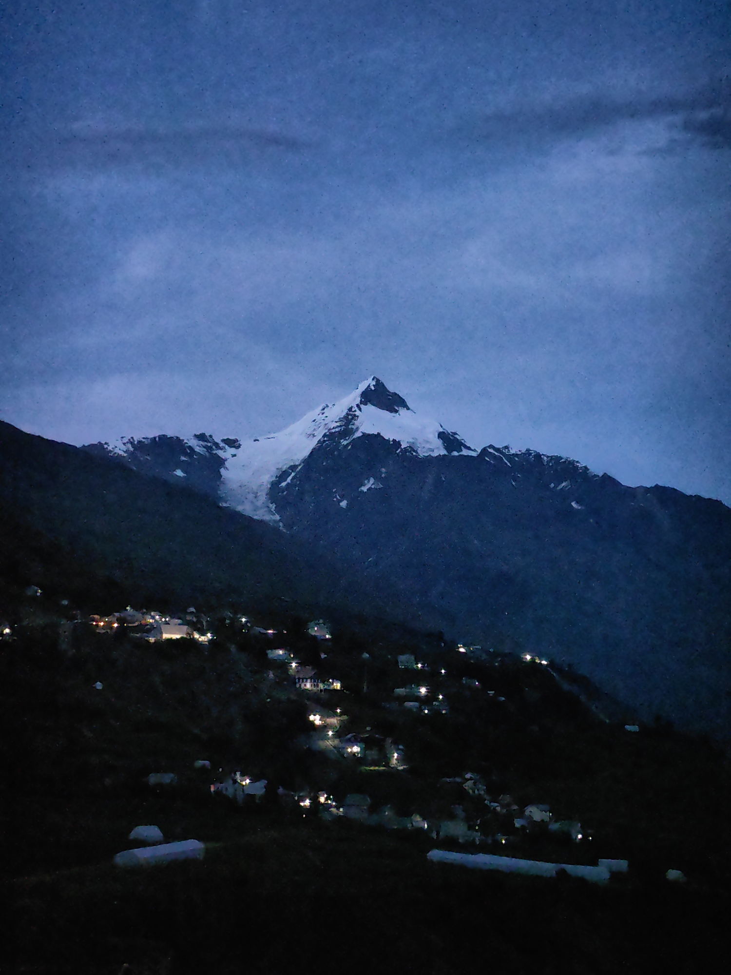 Moonrise over Gondhla village at twilight in the Himalayas