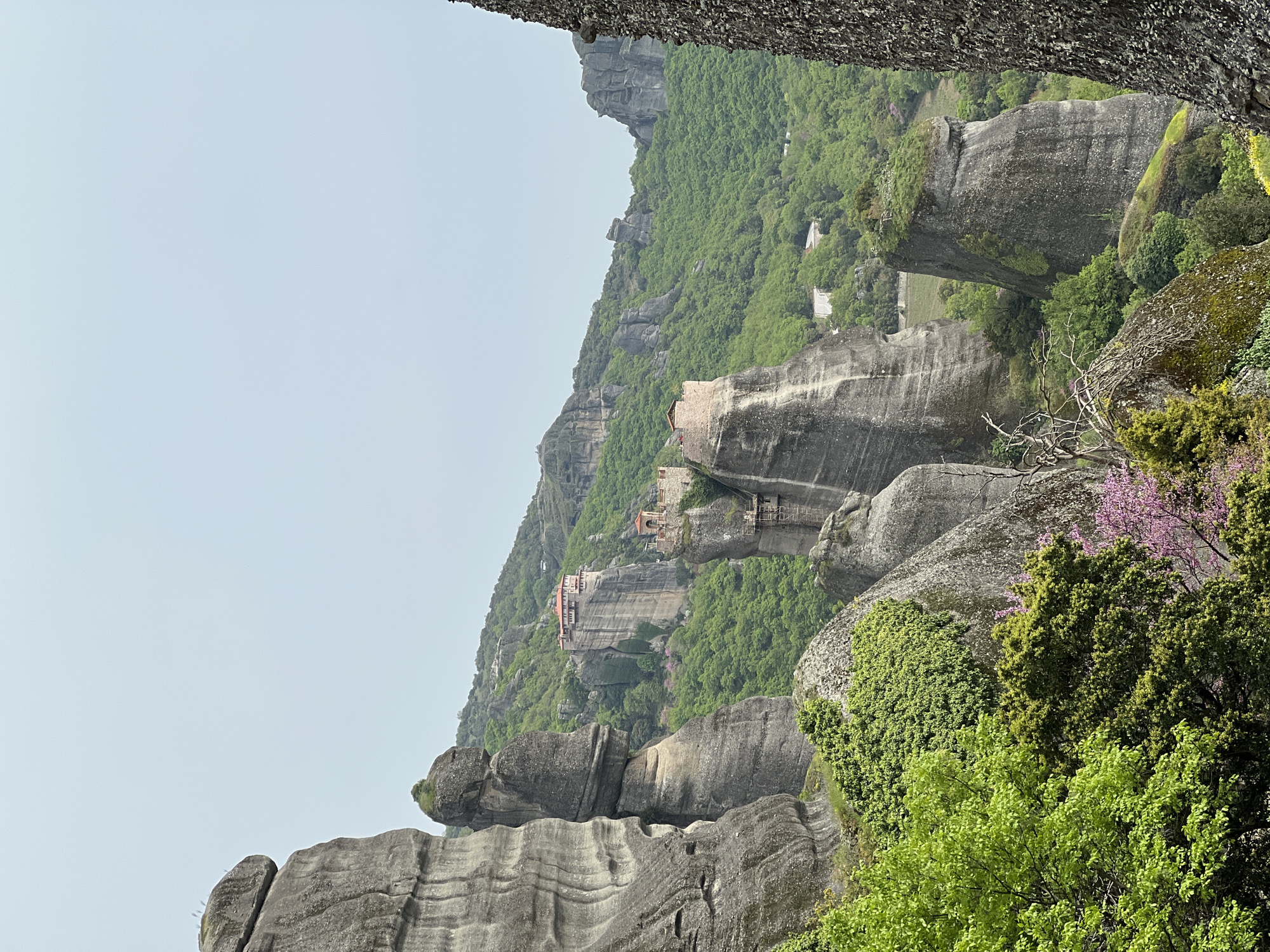 Meteora's towering rock formations documented under overcast Greek skies