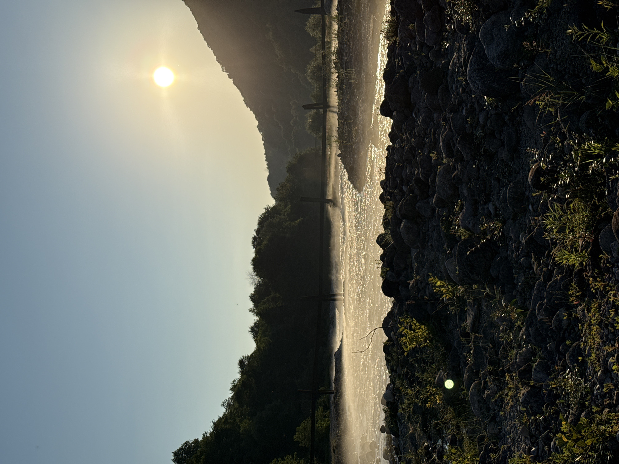 Low sun over an Abkhazian riverside at golden hour