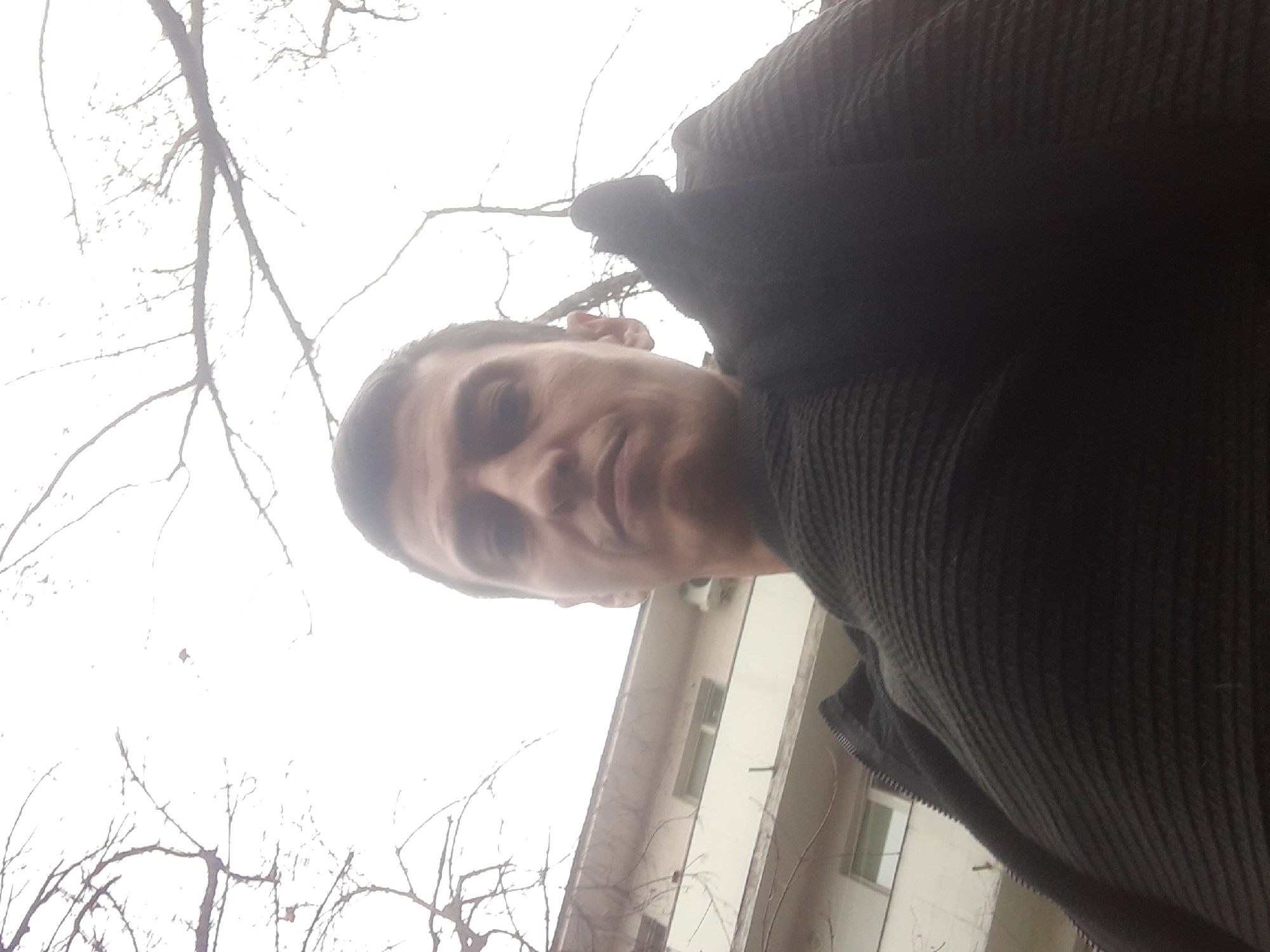 Man takes selfie while dog rests in Sofia park