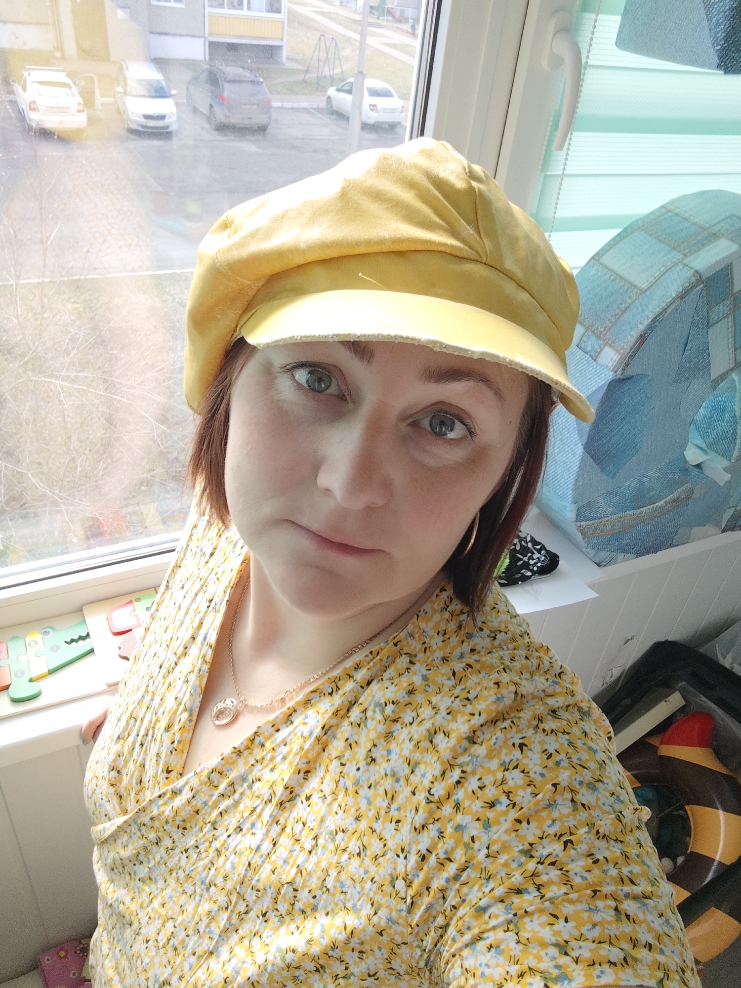 Woman in yellow floral outfit photographed in Markovskii
