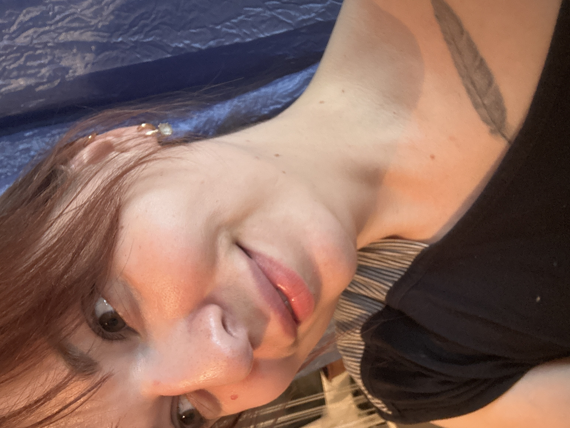 Woman takes selfie showing tattoo in Фоки, Russia