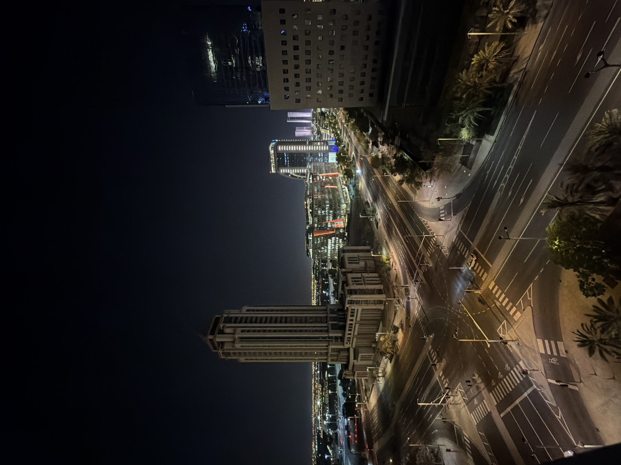 Lusail at night: glowing Ferris wheel and city infrastructure