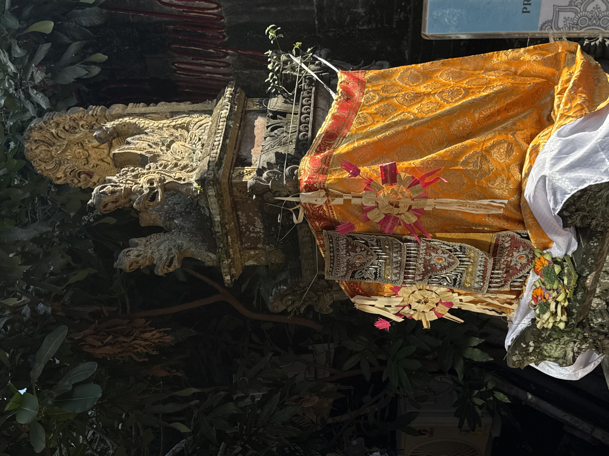 Macaques and temple statues at a Ubud sacred site