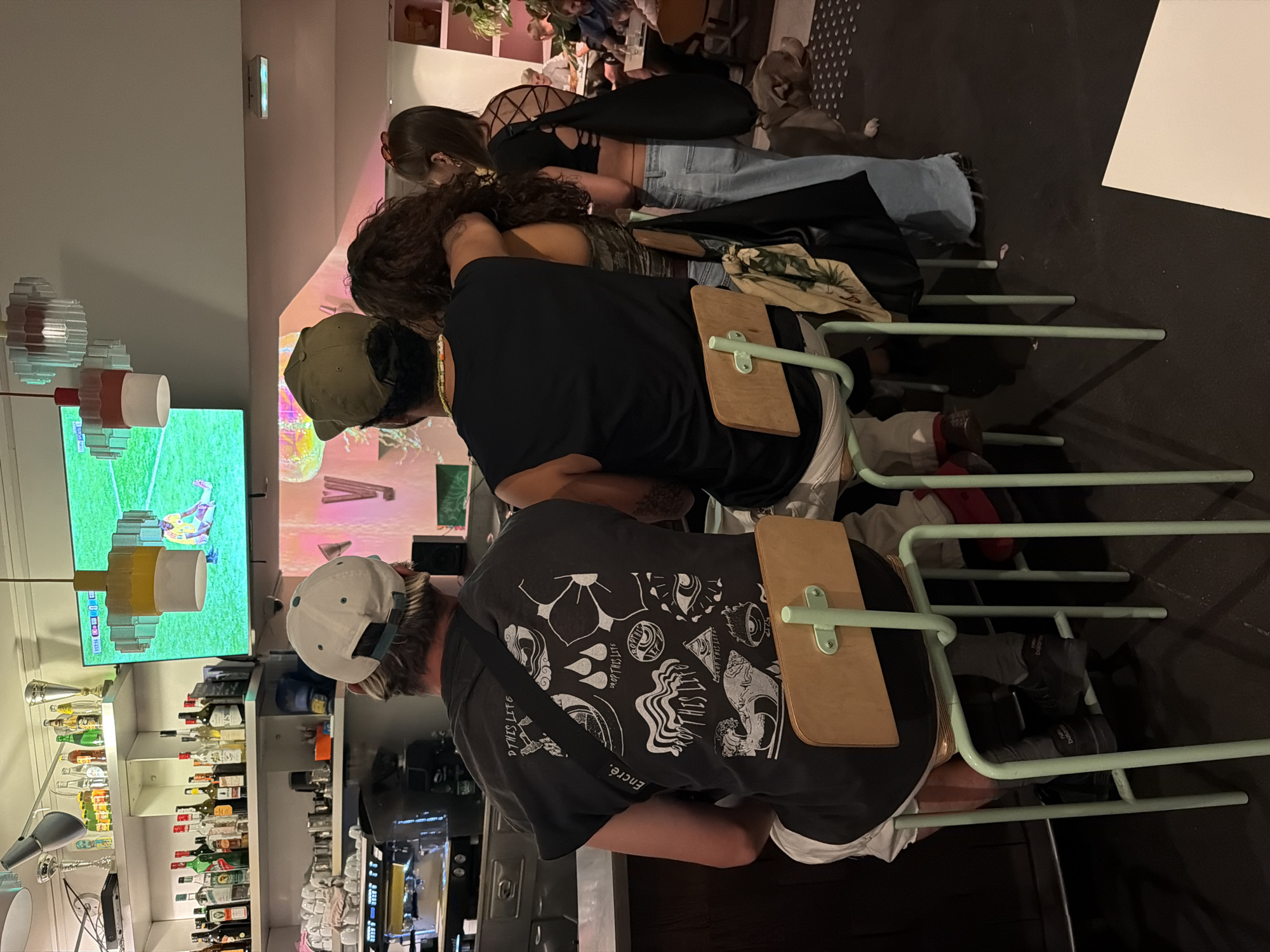 Bar night in Lyon: soccer on screen, drinks, and a dog