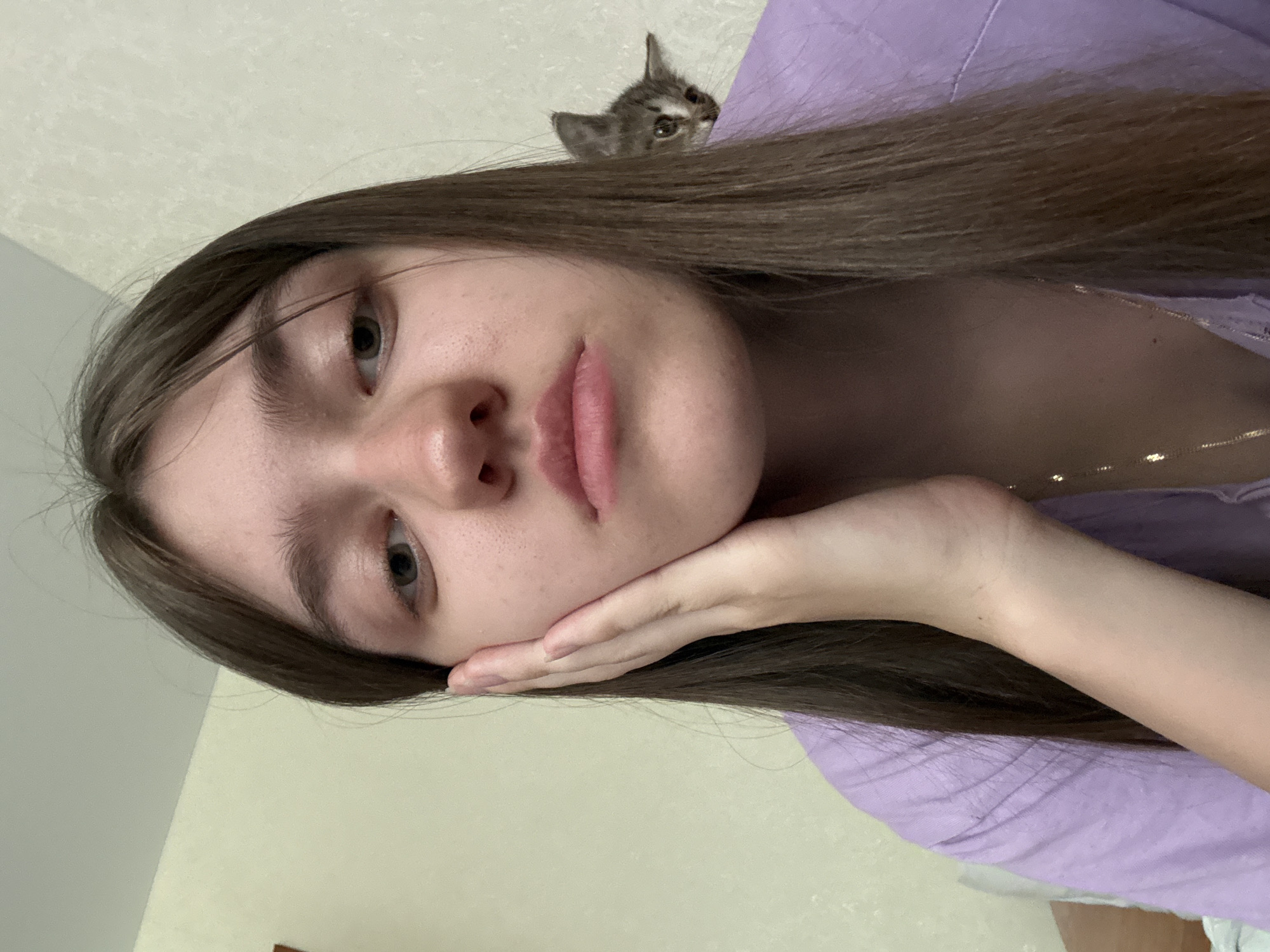 Woman documents quiet morning moments with kitten and food