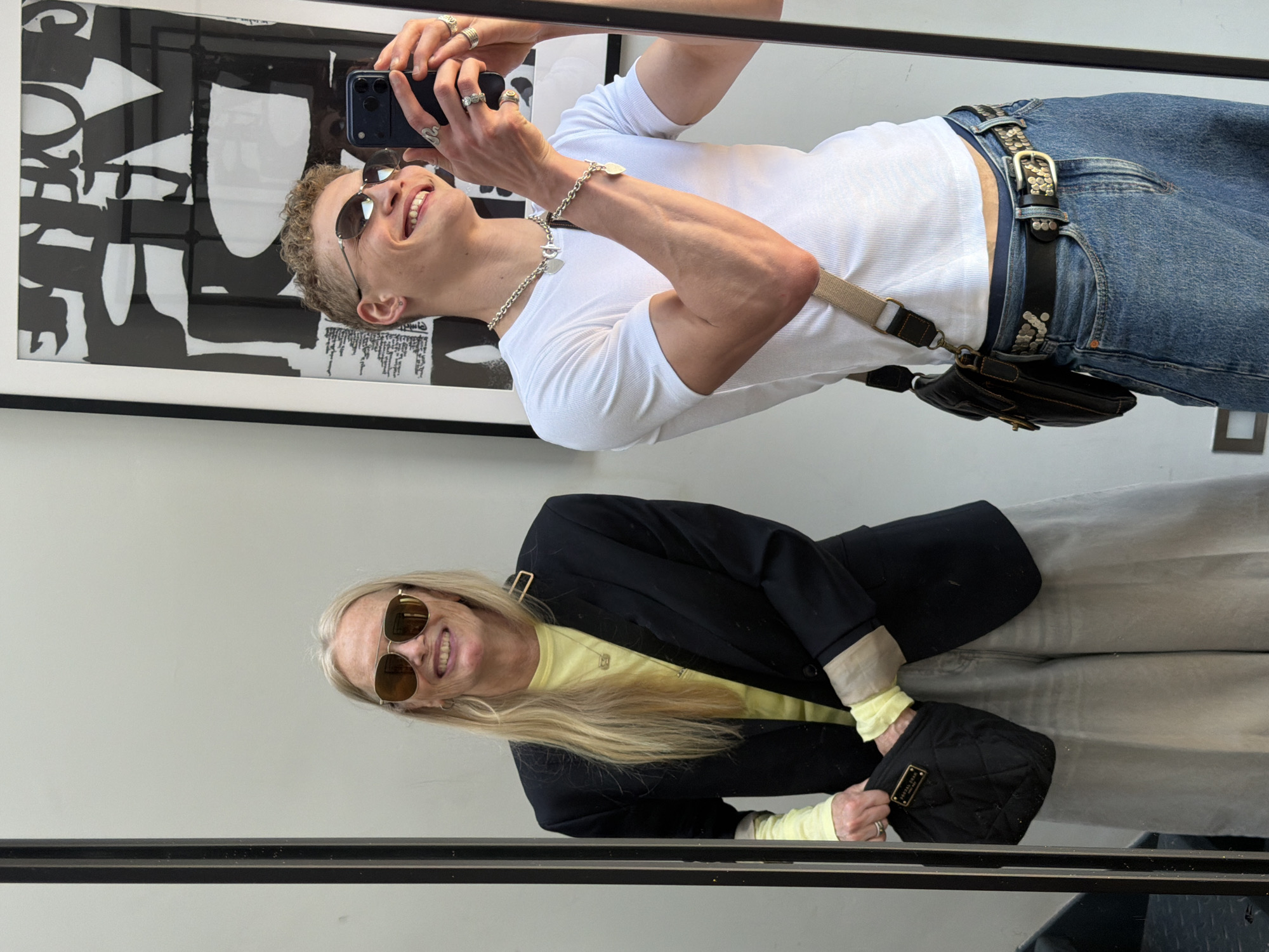 Mirror selfie captured between young man and older woman in London