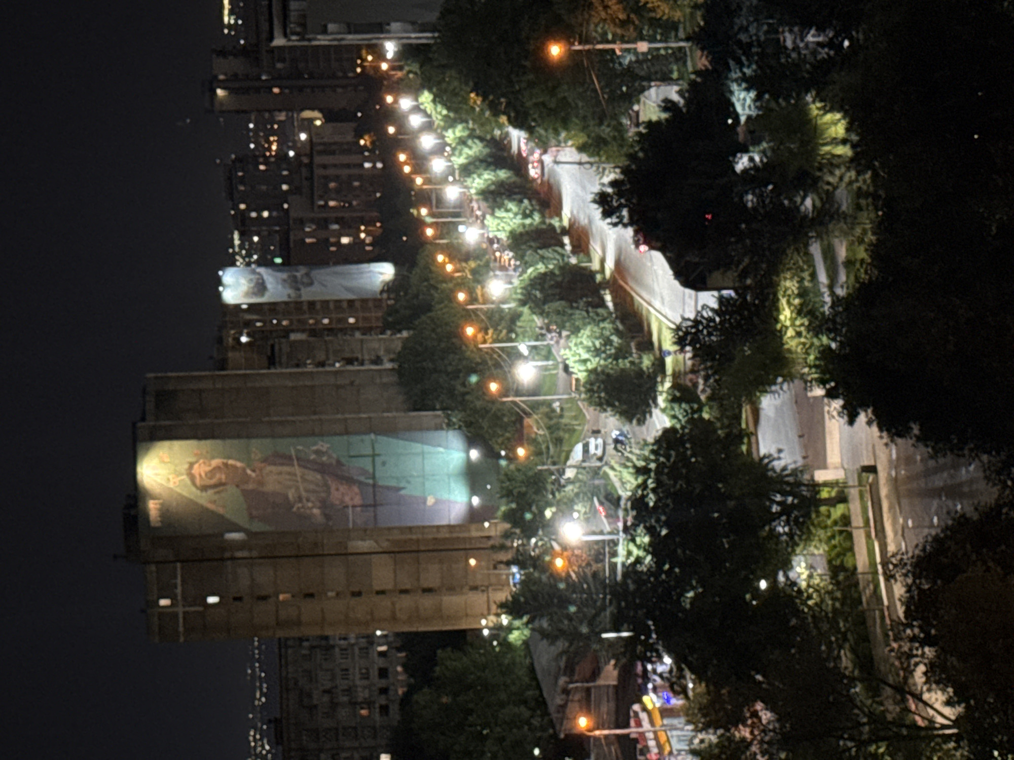 Night views over a mural-marked residential street in Tbilisi