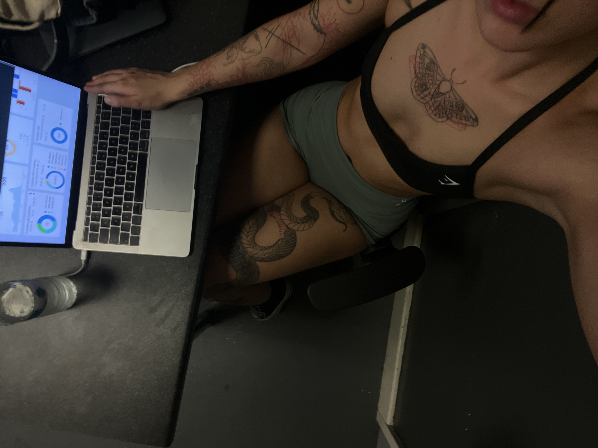 Person uses MacBook at table in Tunbridge Wells