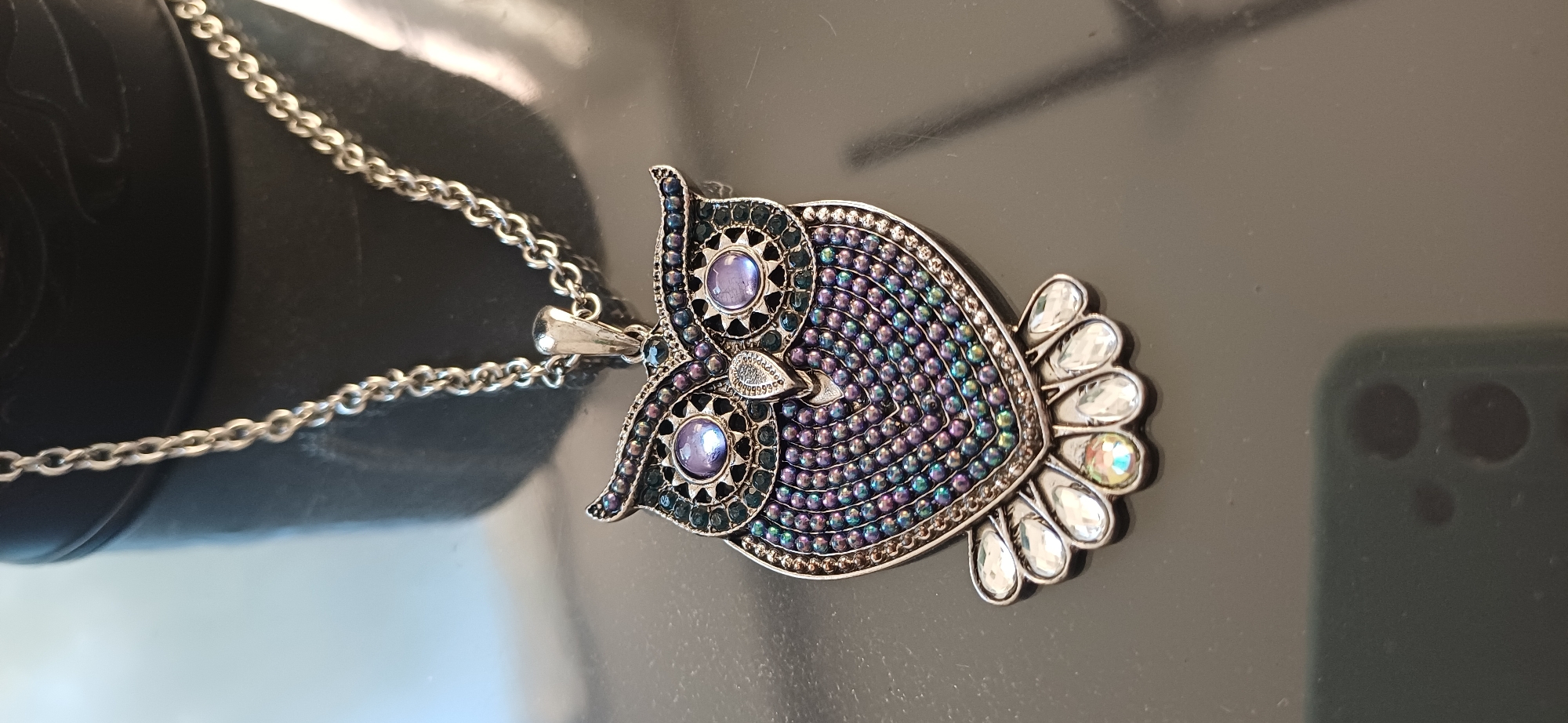 Jewelry and accessories spread: necklaces, earrings, sunglasses, and hair ties