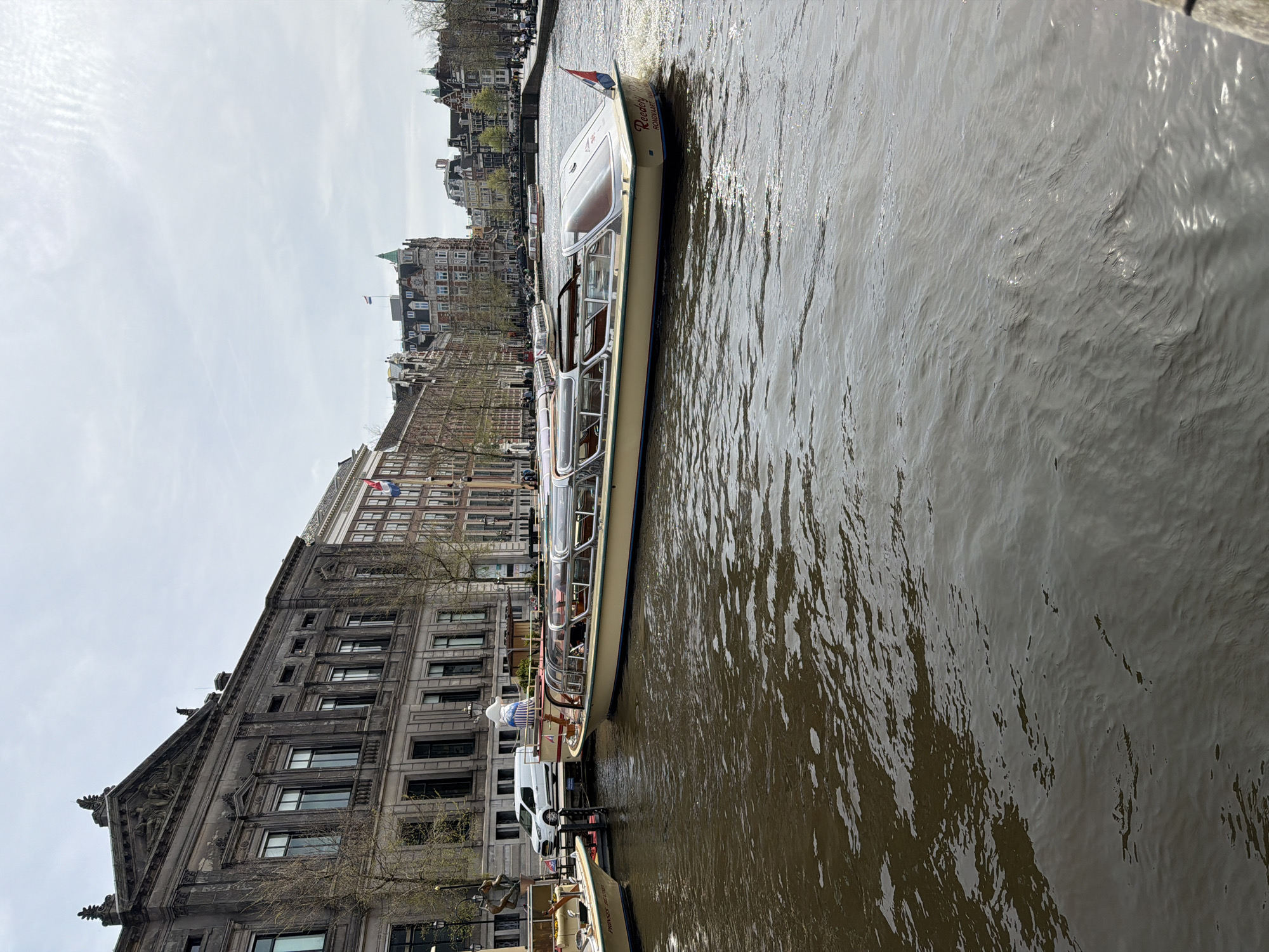Spring morning scenes captured across Amsterdam canals and streets