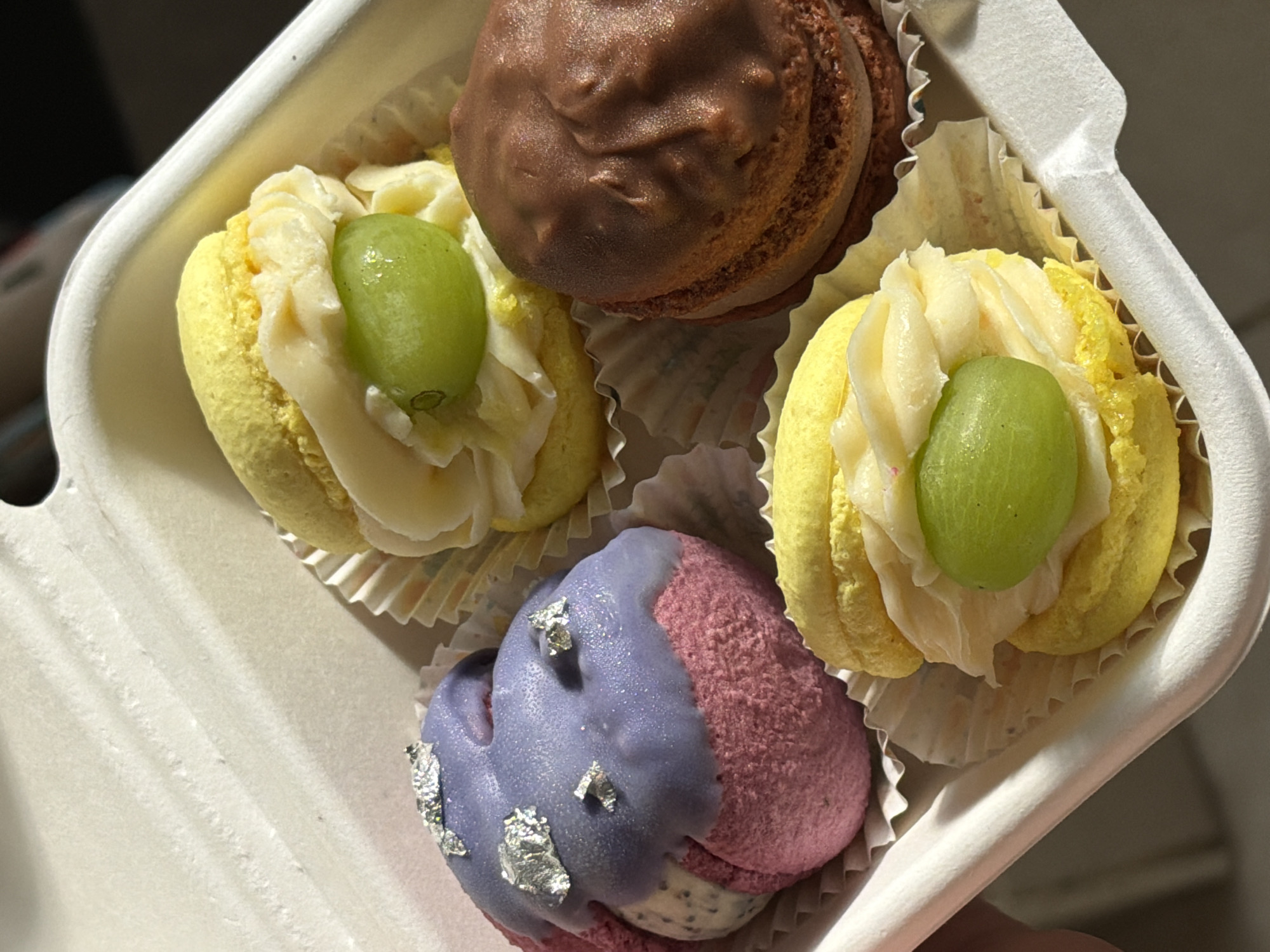Decorative macarons photographed in white container in Tel Aviv