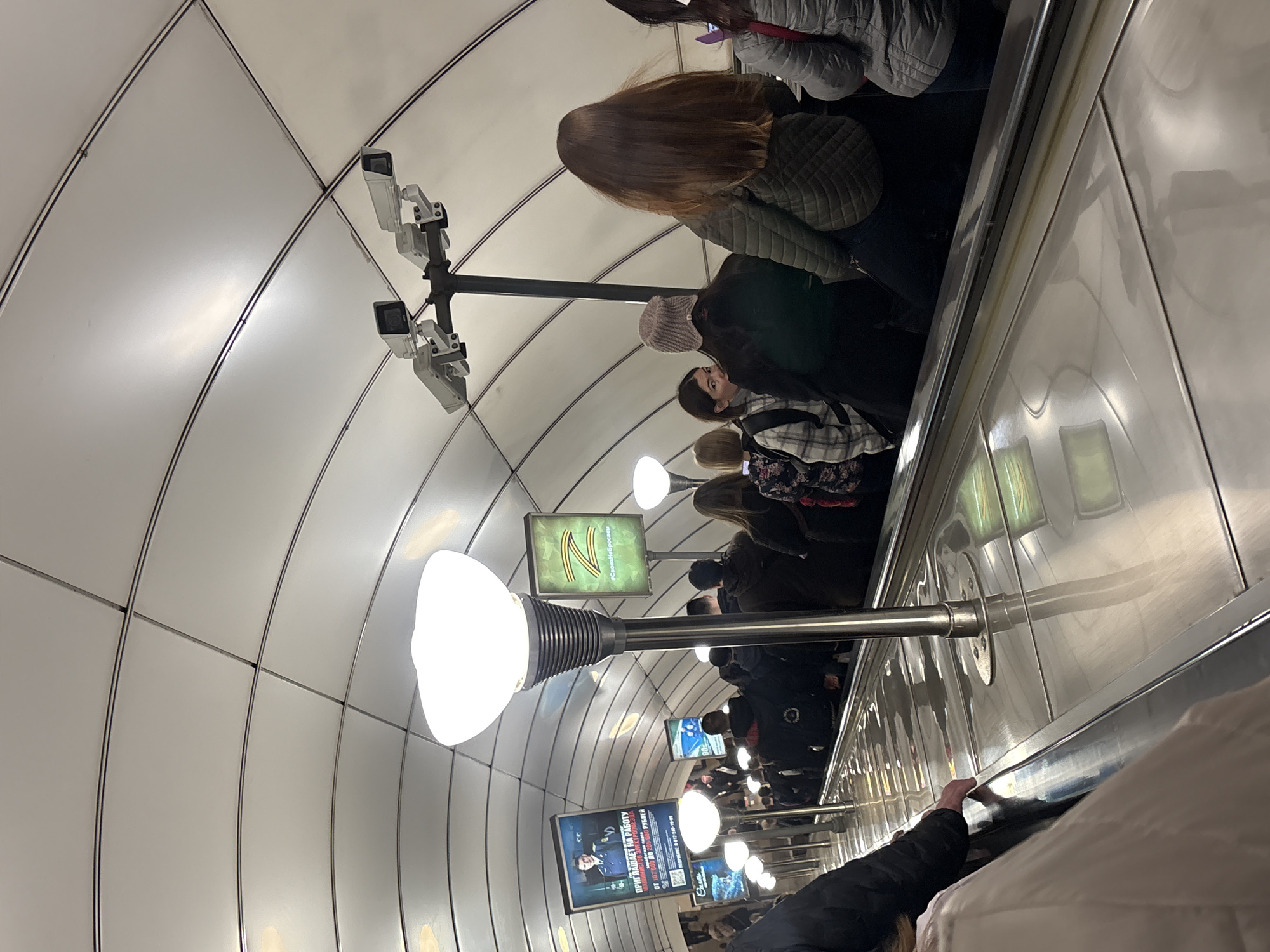 Morning commuters ride escalators in Saint Petersburg metro station