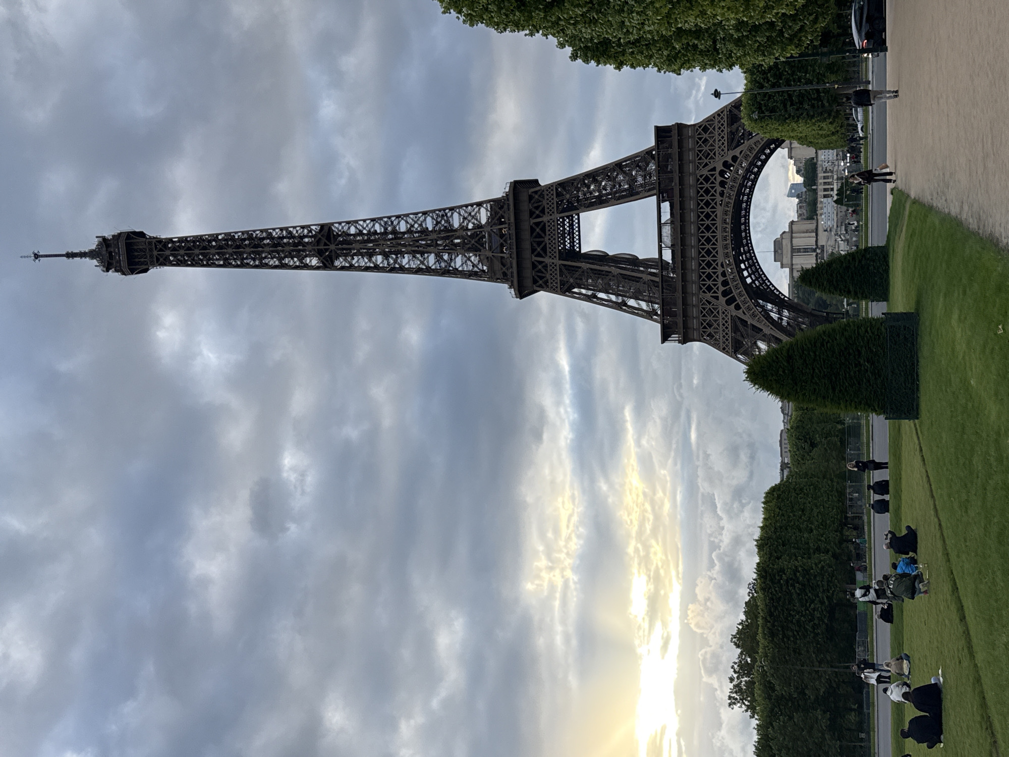Eiffel Tower photographed against cloudy Paris sky
